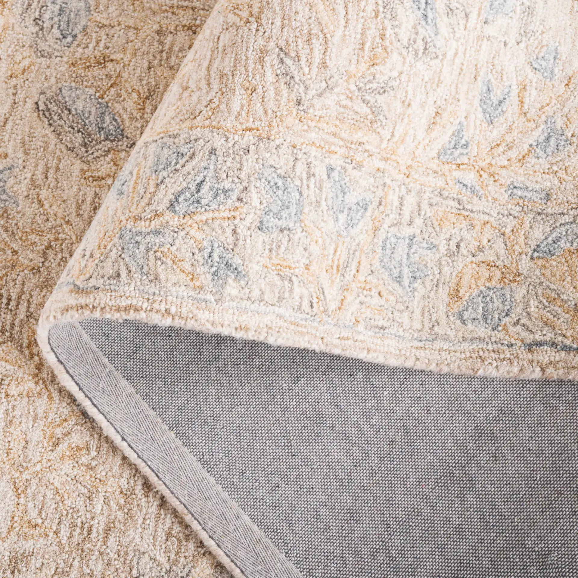 Jardin Botanical Border Hand-Tufted Wool Rug in Beige / Gray in a styled room