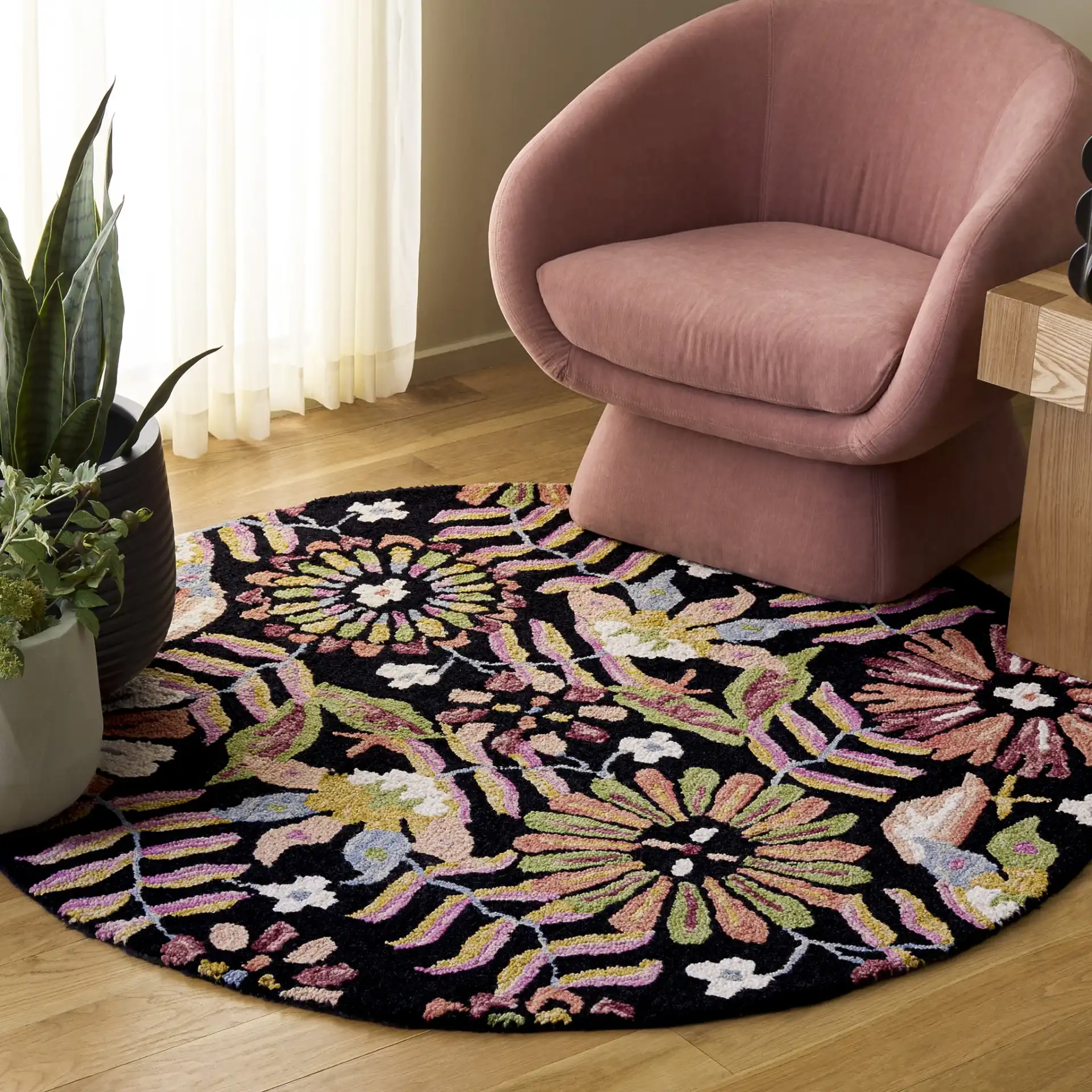 Jardin Boho Floral Hand-Tufted Wool Rug in Black / Pink in a styled room