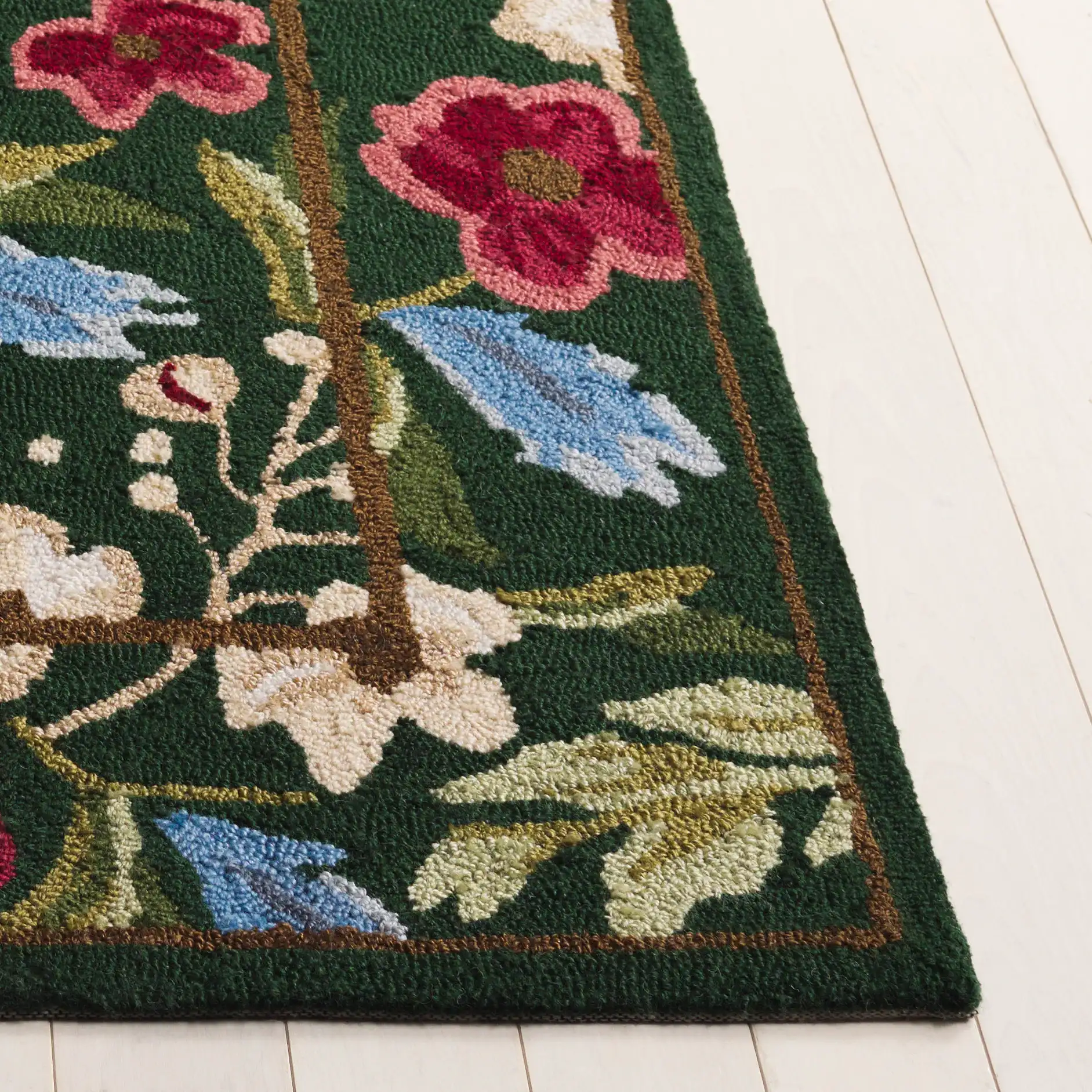 Jardin Floral Border Hand-Tufted Rug in Green / Red in a styled room
