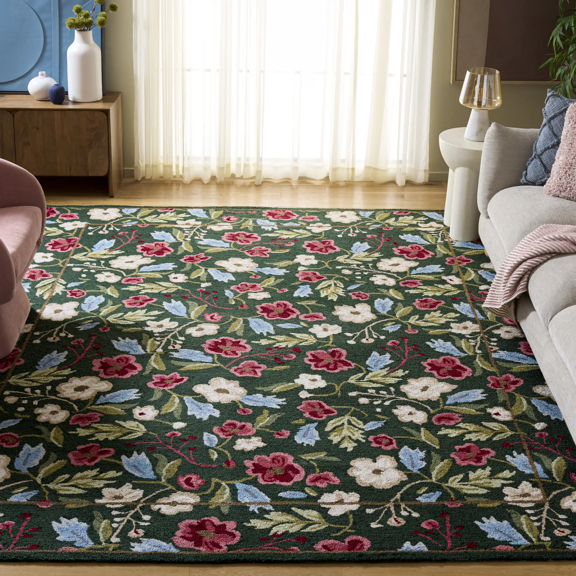 Jardin Floral Border Hand-Tufted Rug in Green / Red in a styled room