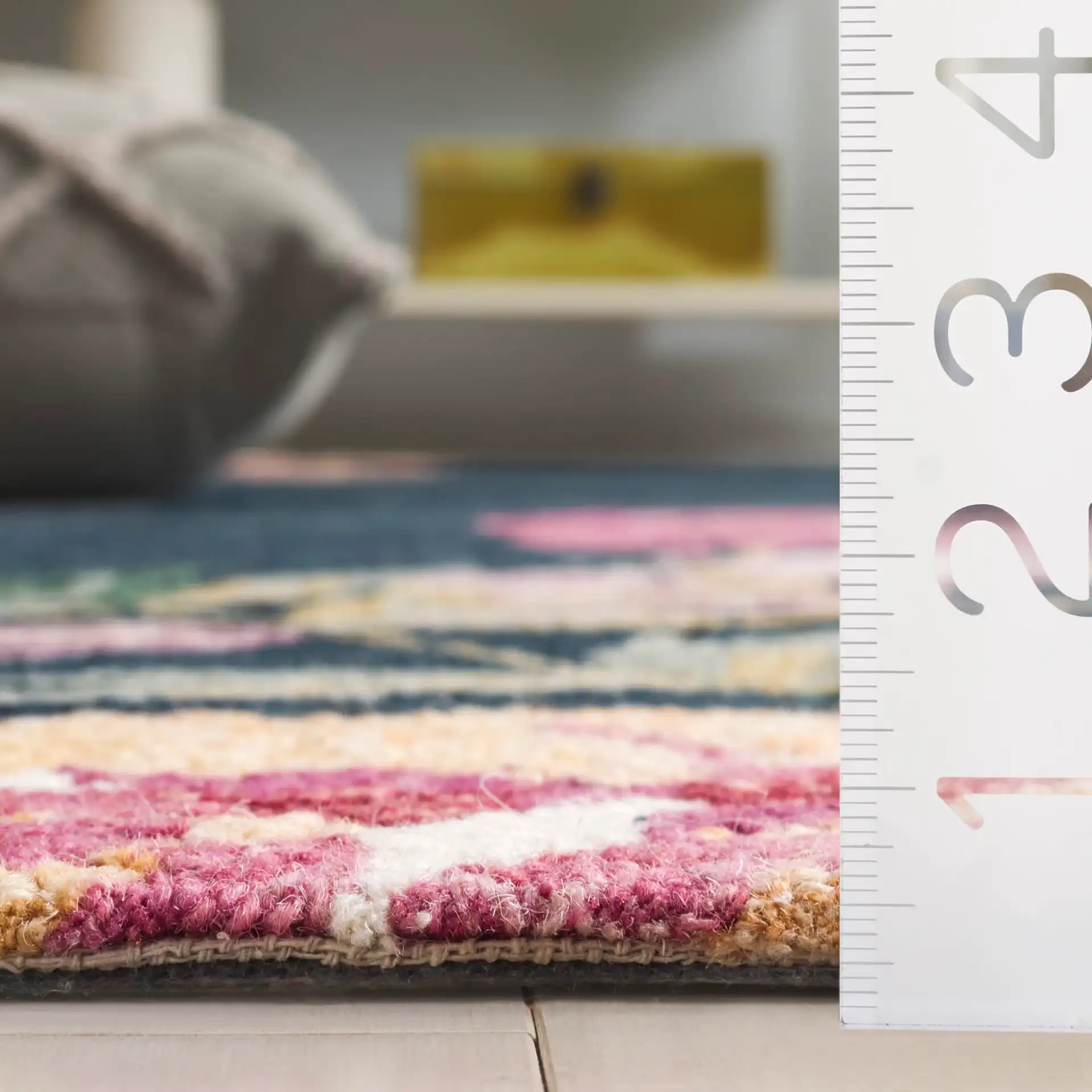 Jardin Asymmetrical Floral Hand-Tufted Wool Rug in Navy / Pink in a styled room