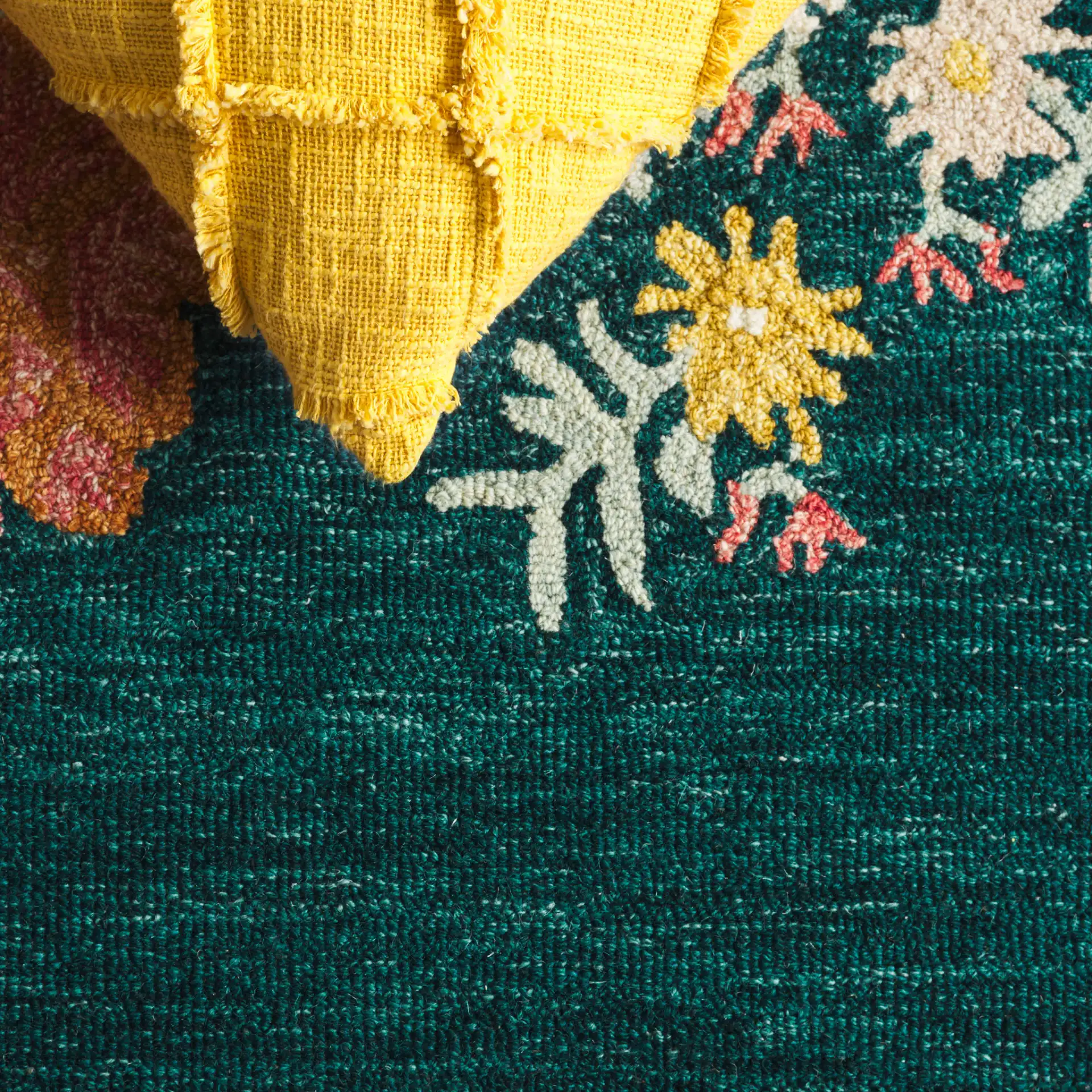 Jardin Floral Border Hand-Tufted Wool Rug in Dark Green / Pink in a styled room