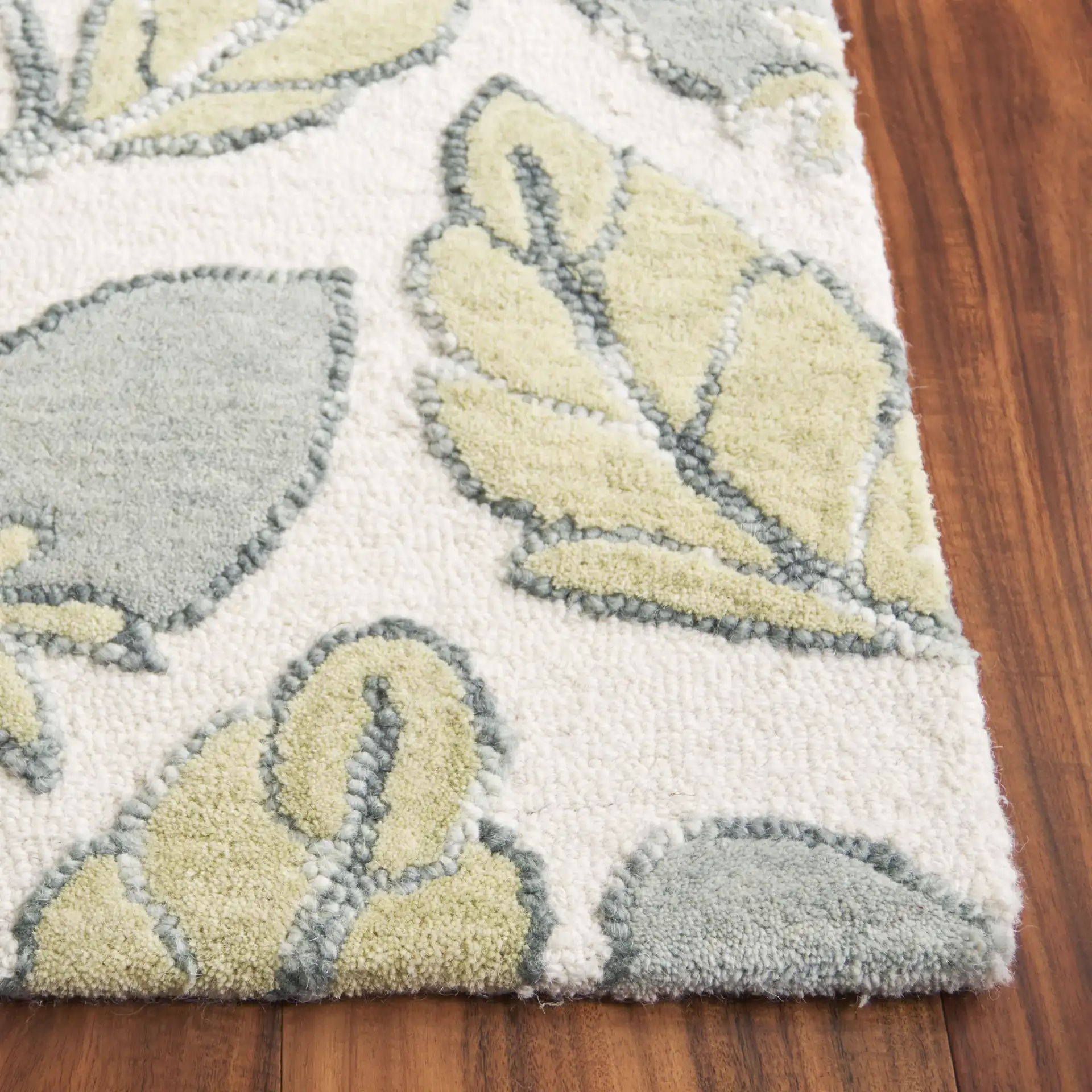 Jardin Climbing Vine Hand-Tufted Wool Rug in Green in a styled room