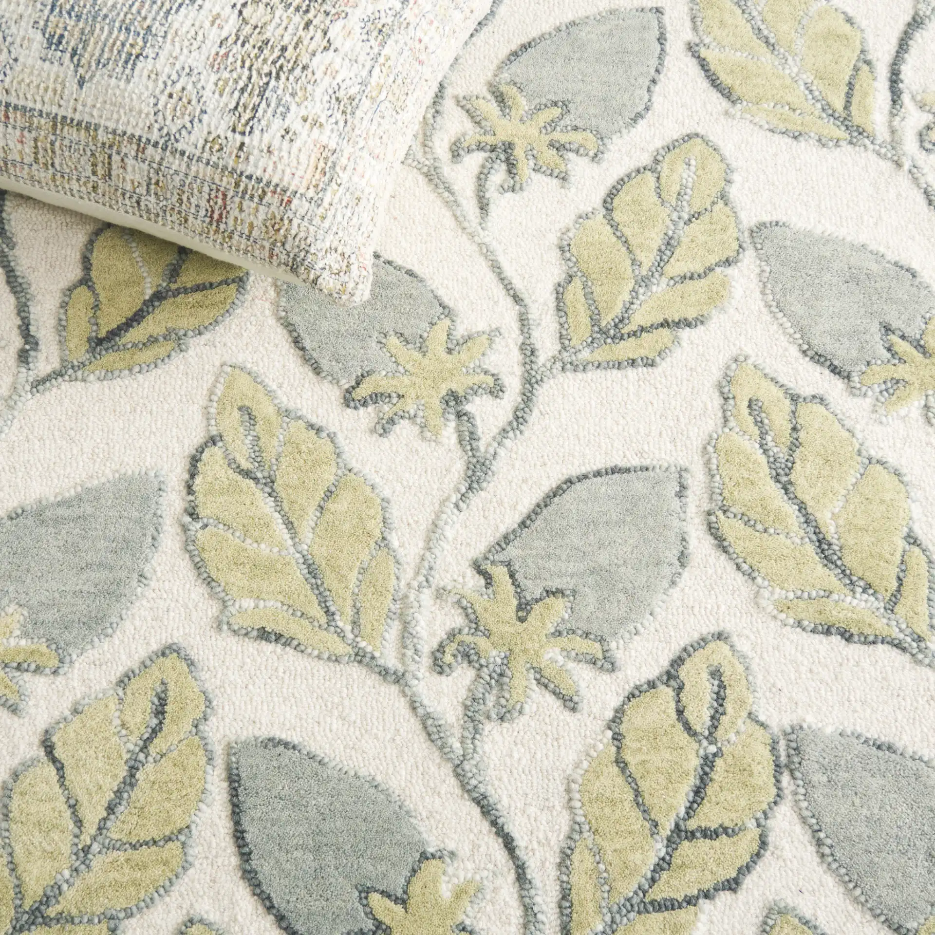 Jardin Climbing Vine Hand-Tufted Wool Rug in Green in a styled room