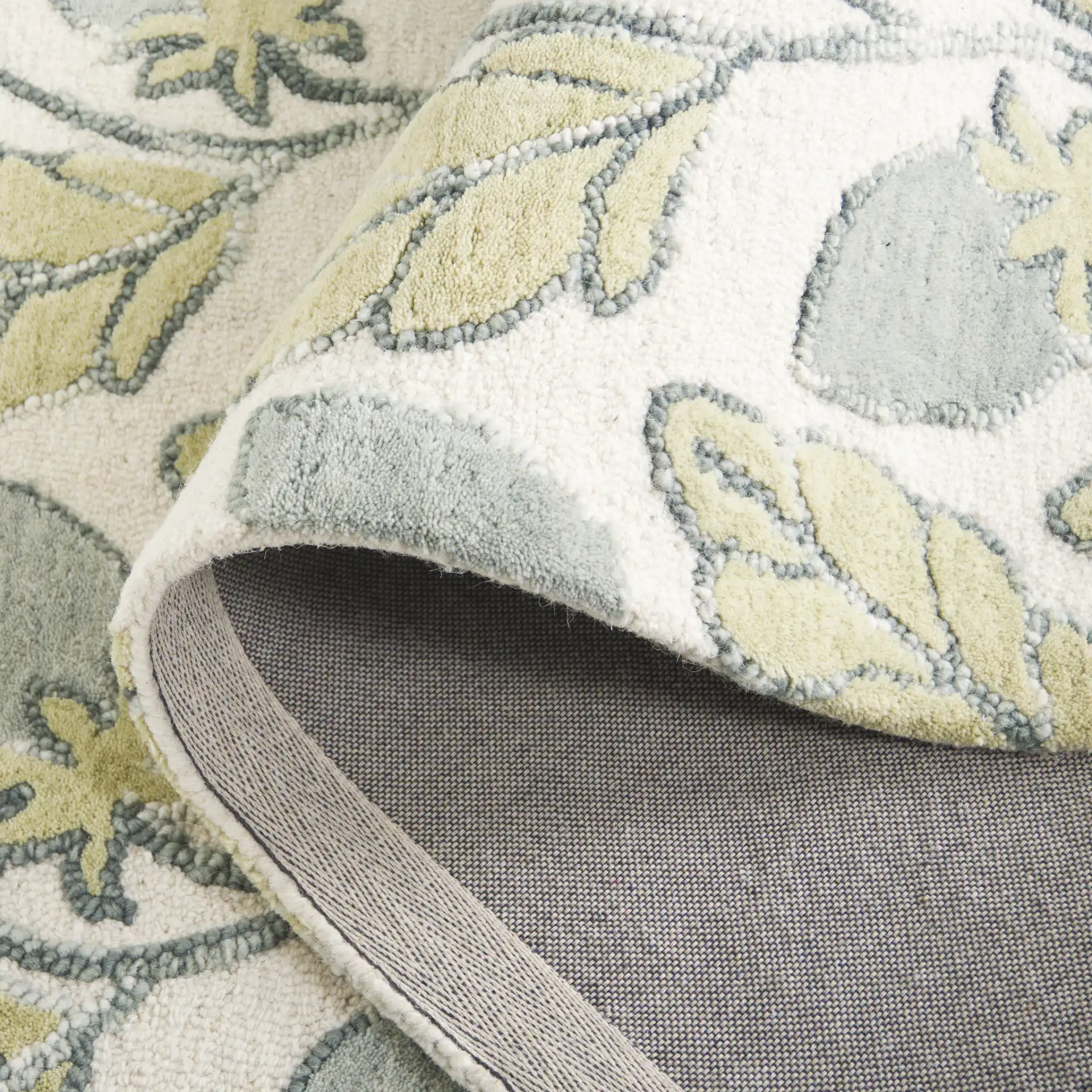 Jardin Climbing Vine Hand-Tufted Wool Rug in Green in a styled room