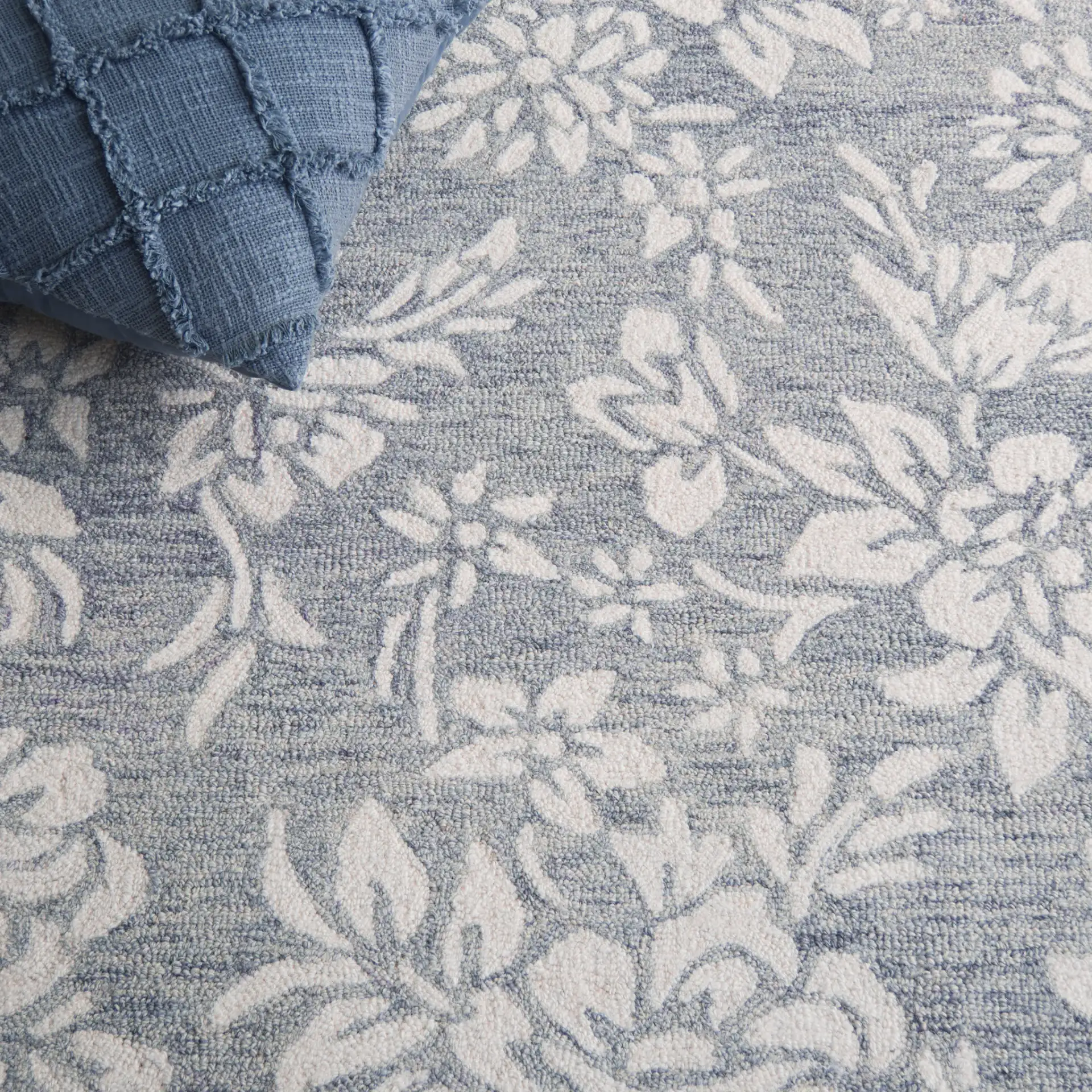 Jardin Bordered Floral Hand-Tufted Wool Rug in Gray / Ivory in a styled room