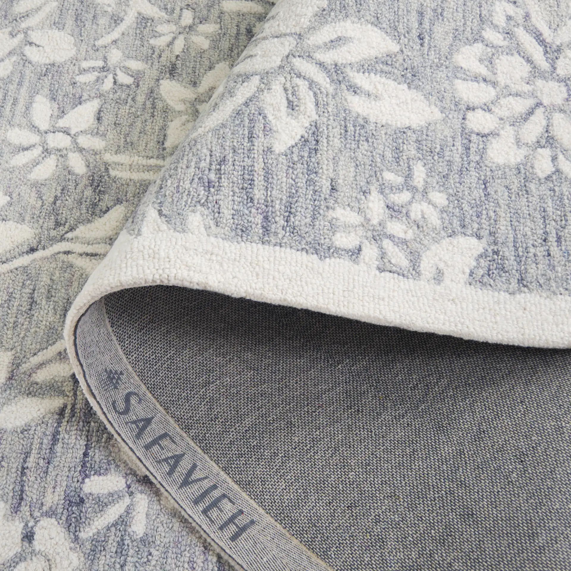 Jardin Bordered Floral Hand-Tufted Wool Rug in Gray / Ivory in a styled room