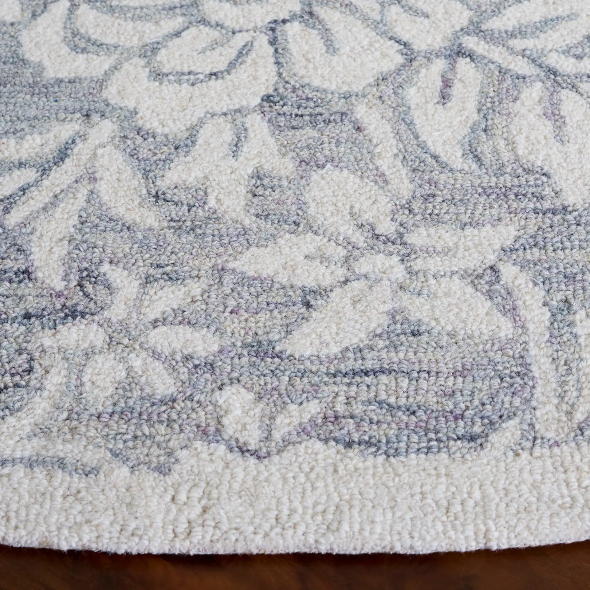Jardin Bordered Floral Hand-Tufted Wool Rug in Gray / Ivory in a styled room