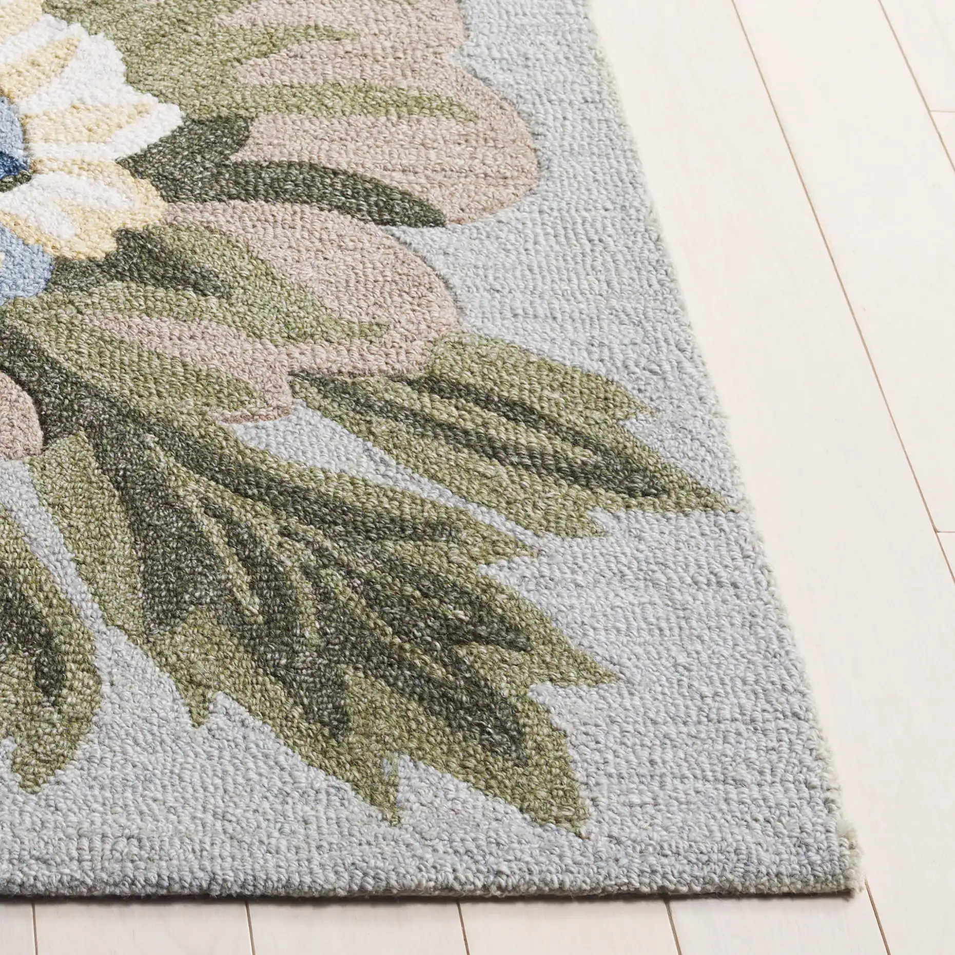 Jardin Packed Floral Hand-Tufted Wool Rug in Sage / Blue in a styled room