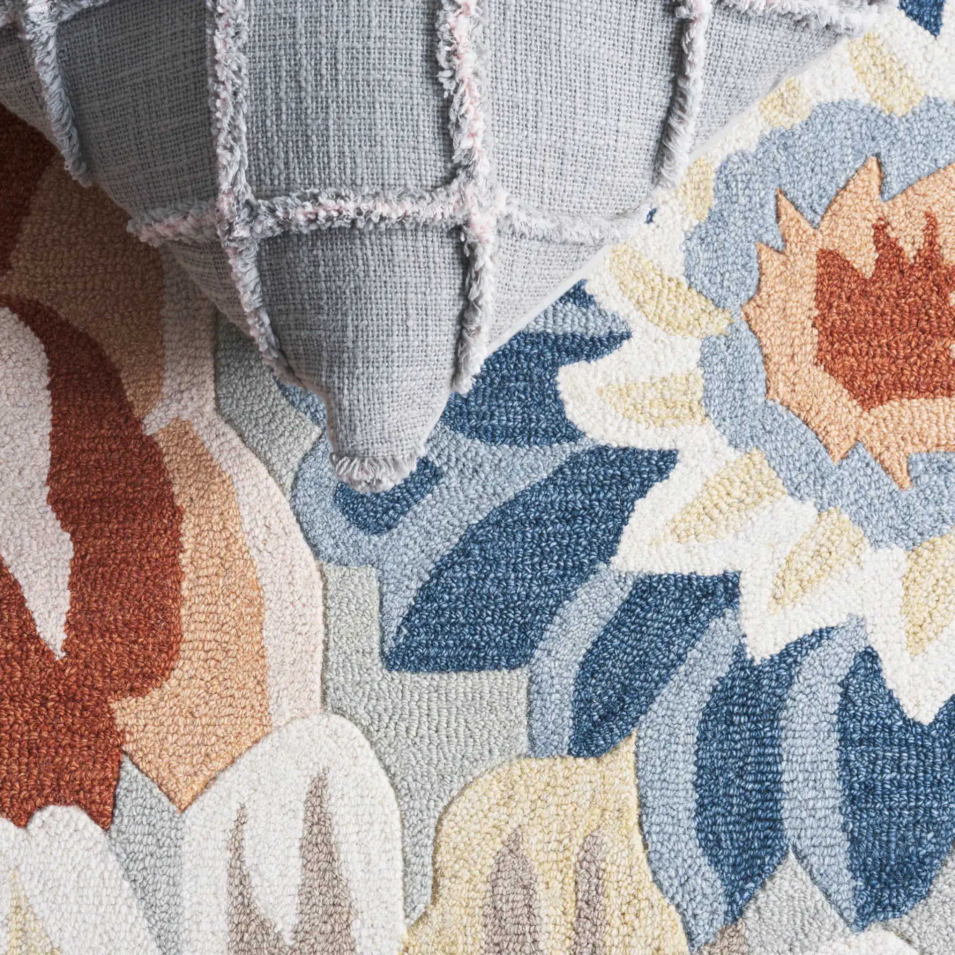 Jardin Packed Floral Hand-Tufted Wool Rug in Sage / Blue in a styled room