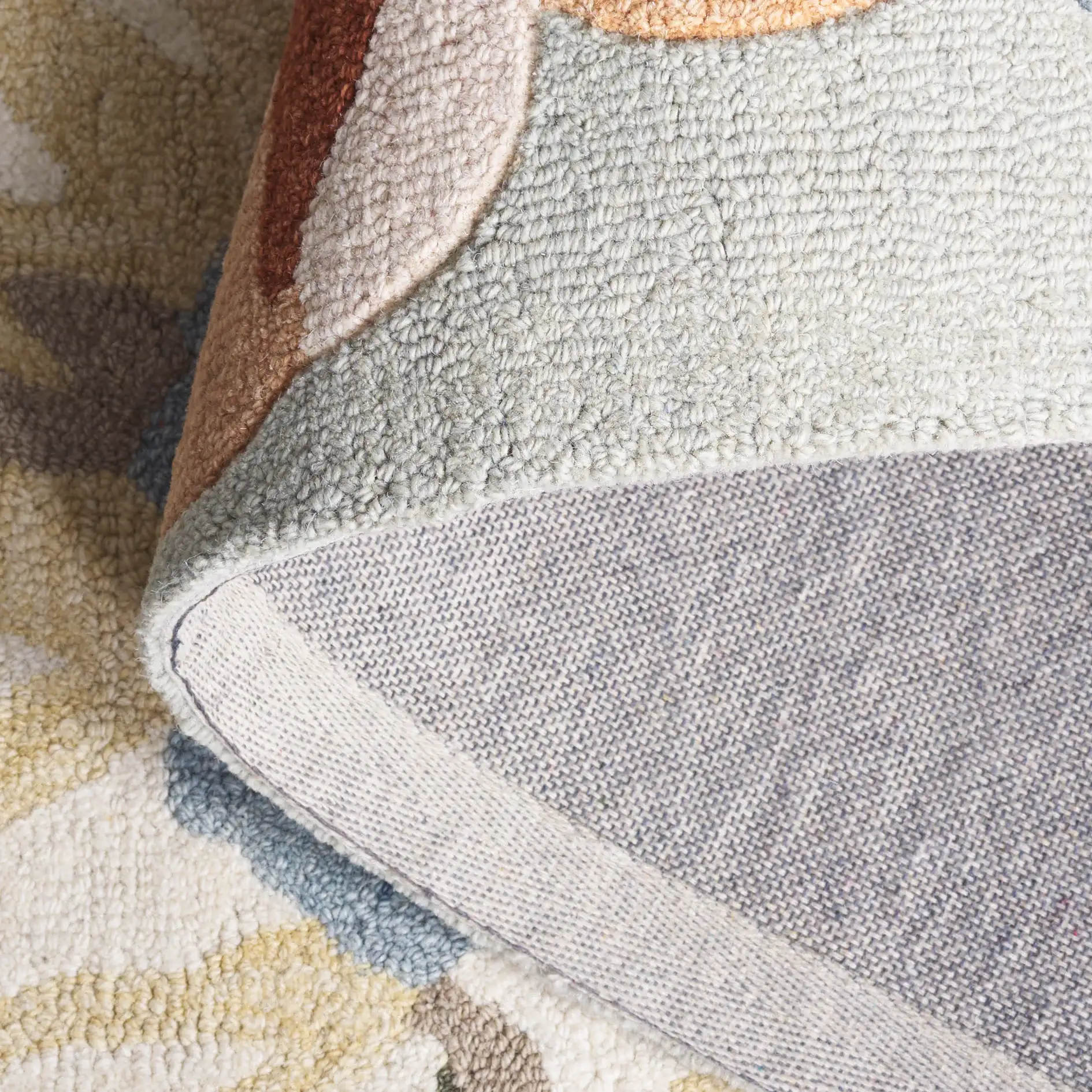 Jardin Packed Floral Hand-Tufted Wool Rug in Sage / Blue in a styled room