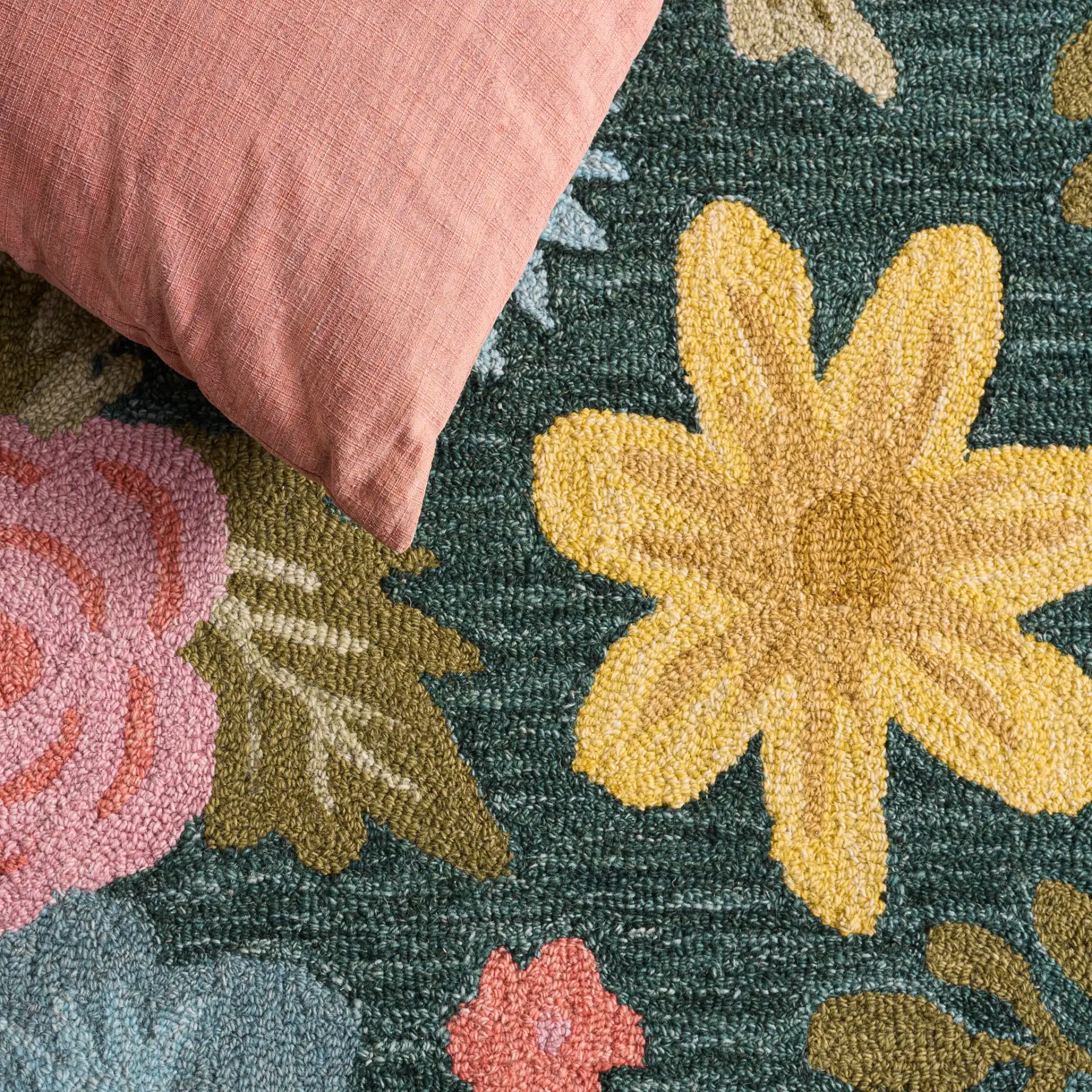 Jardin Folk Floral Hand-Tufted Wool Rug in Green / Blue in a styled room