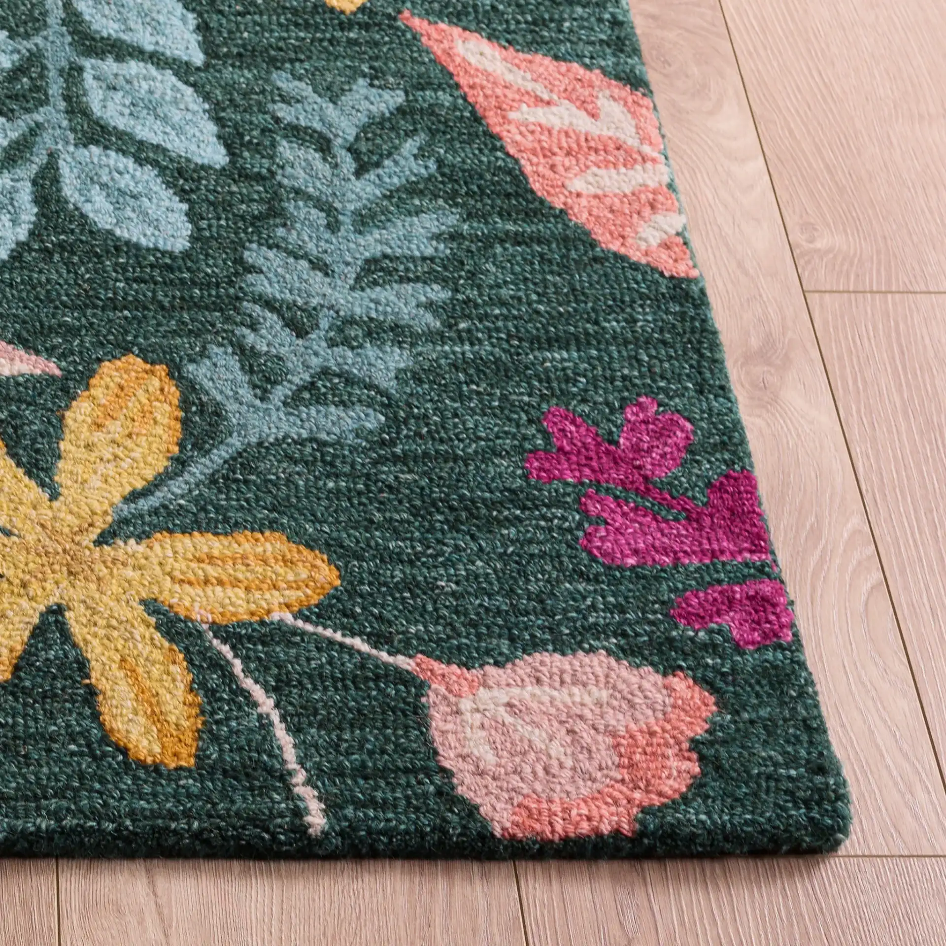Jardin Botanical Floral Hand-Tufted Wool Rug in Green / Yellow in a styled room