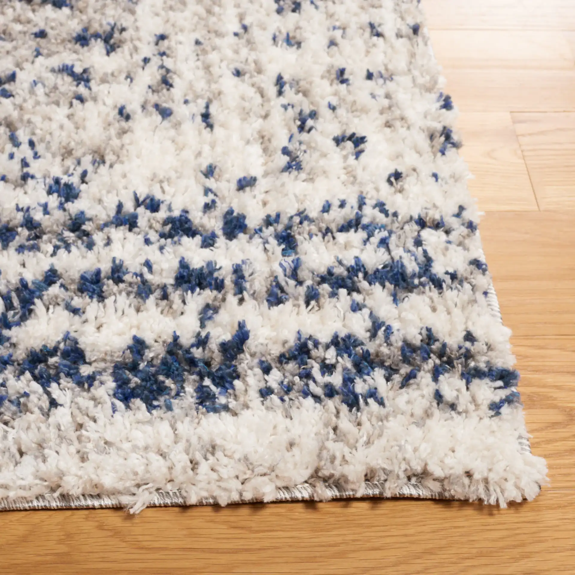 Jericho Striped Shag Rug in Navy / Ivory in a styled room