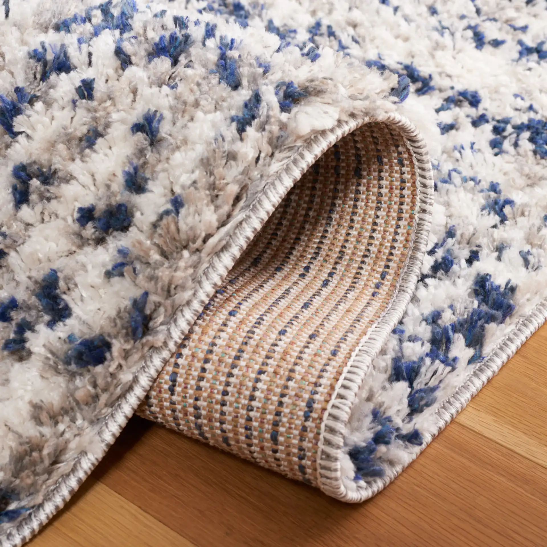 Jericho Striped Shag Rug in Navy / Ivory in a styled room