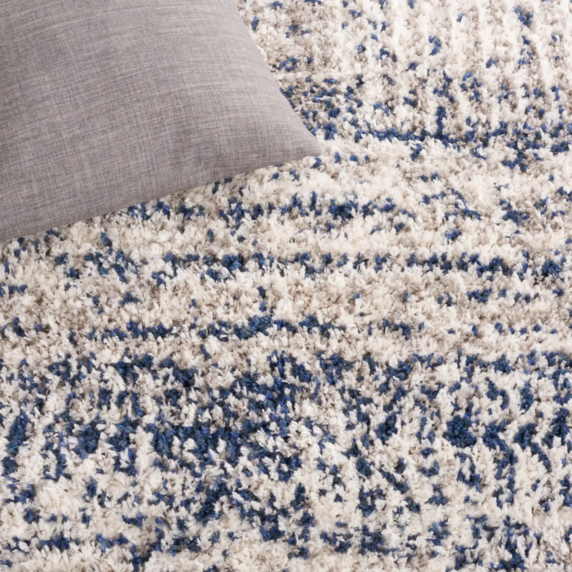 Jericho Striped Shag Rug in Navy / Ivory in a styled room