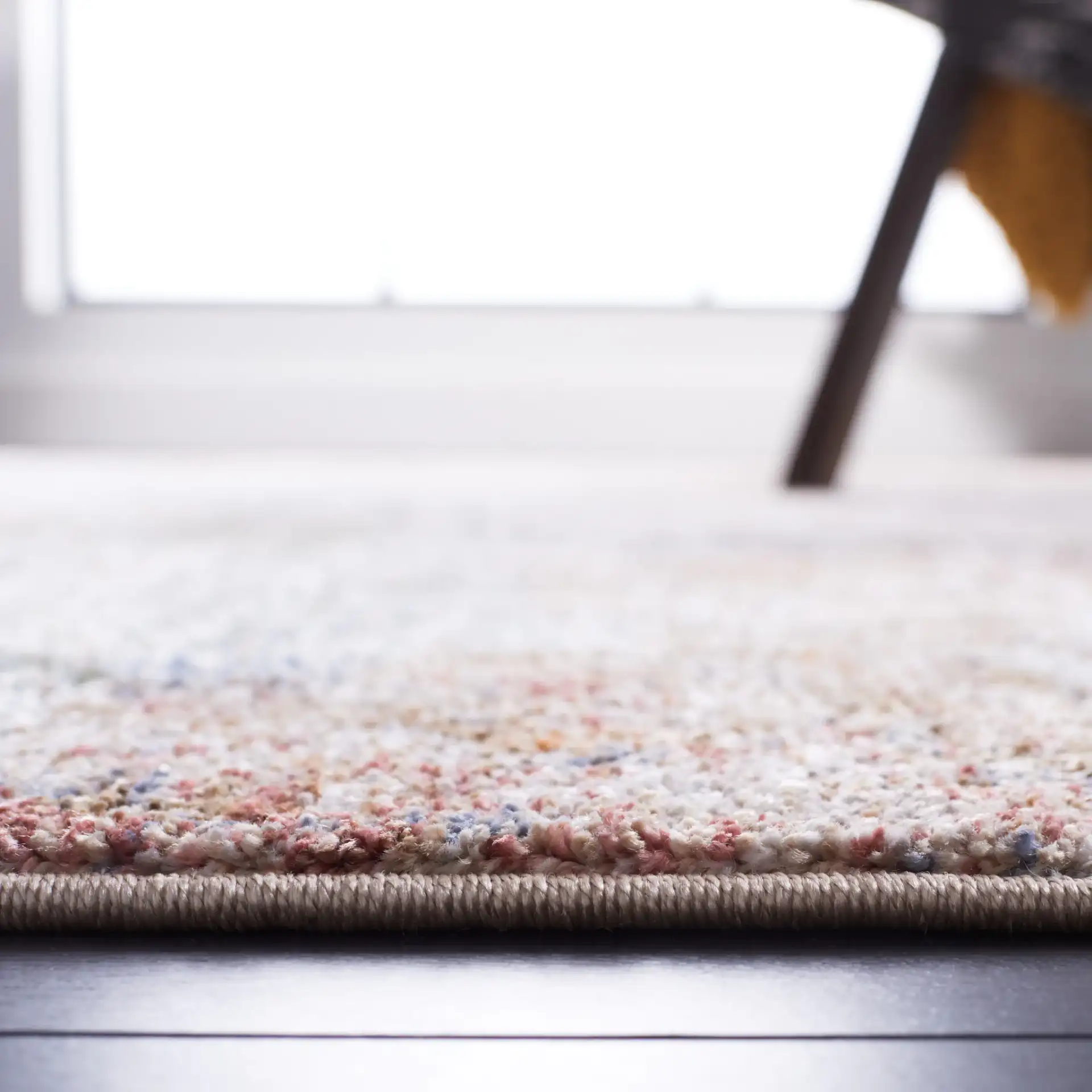 Jasmine Distressed Abstract Rug in Ivory / Blue in a styled room