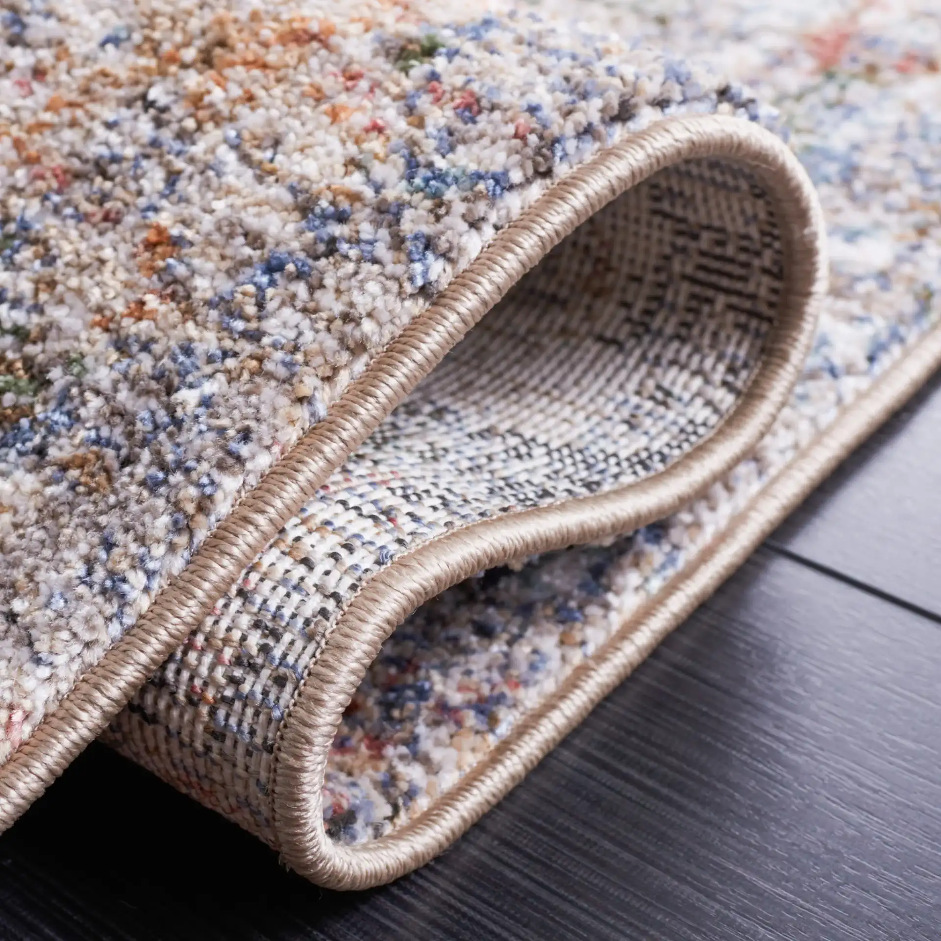 Jasmine Distressed Abstract Rug in Ivory / Blue in a styled room