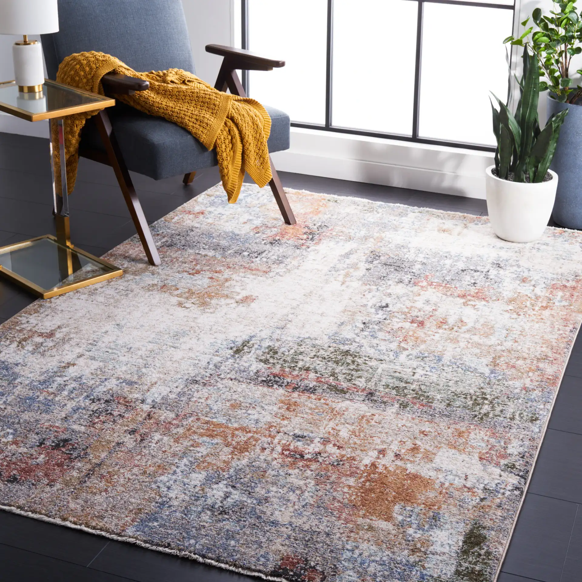 Jasmine Distressed Abstract Rug in Ivory / Blue in a styled room