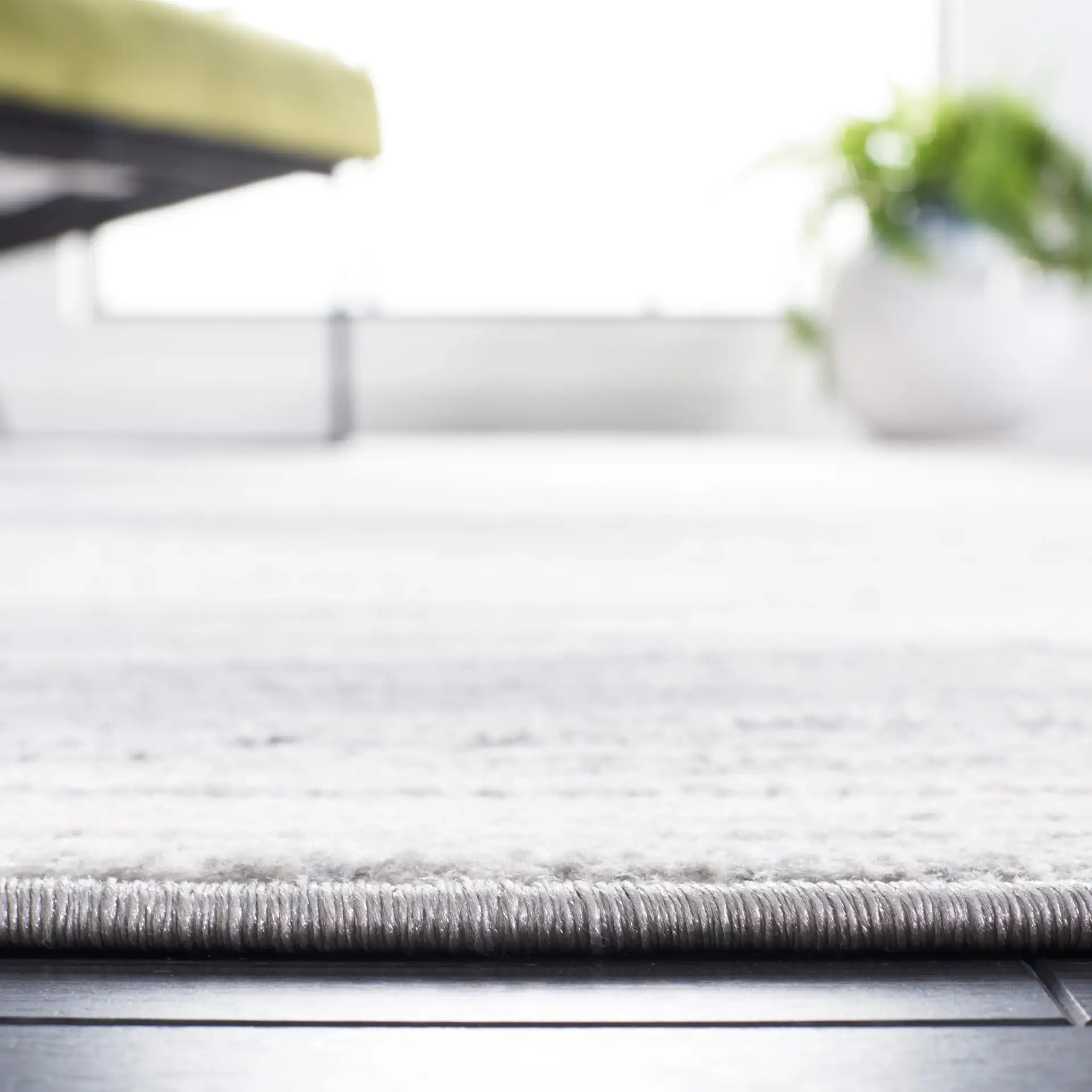 Jasper Abstract Wave Rug in Gray / Ivory in a styled room