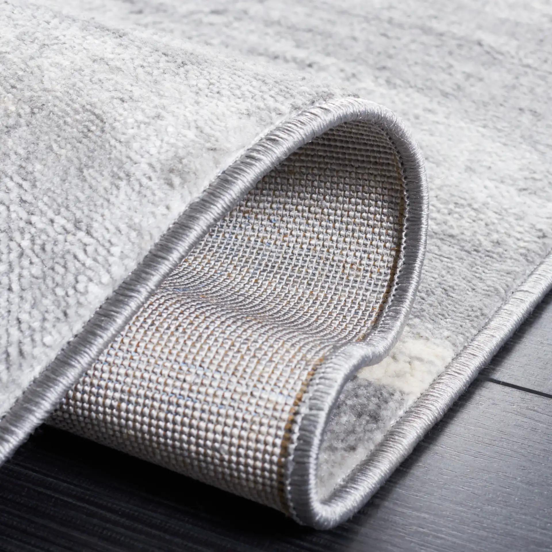Jasper Abstract Wave Rug in Gray / Ivory in a styled room