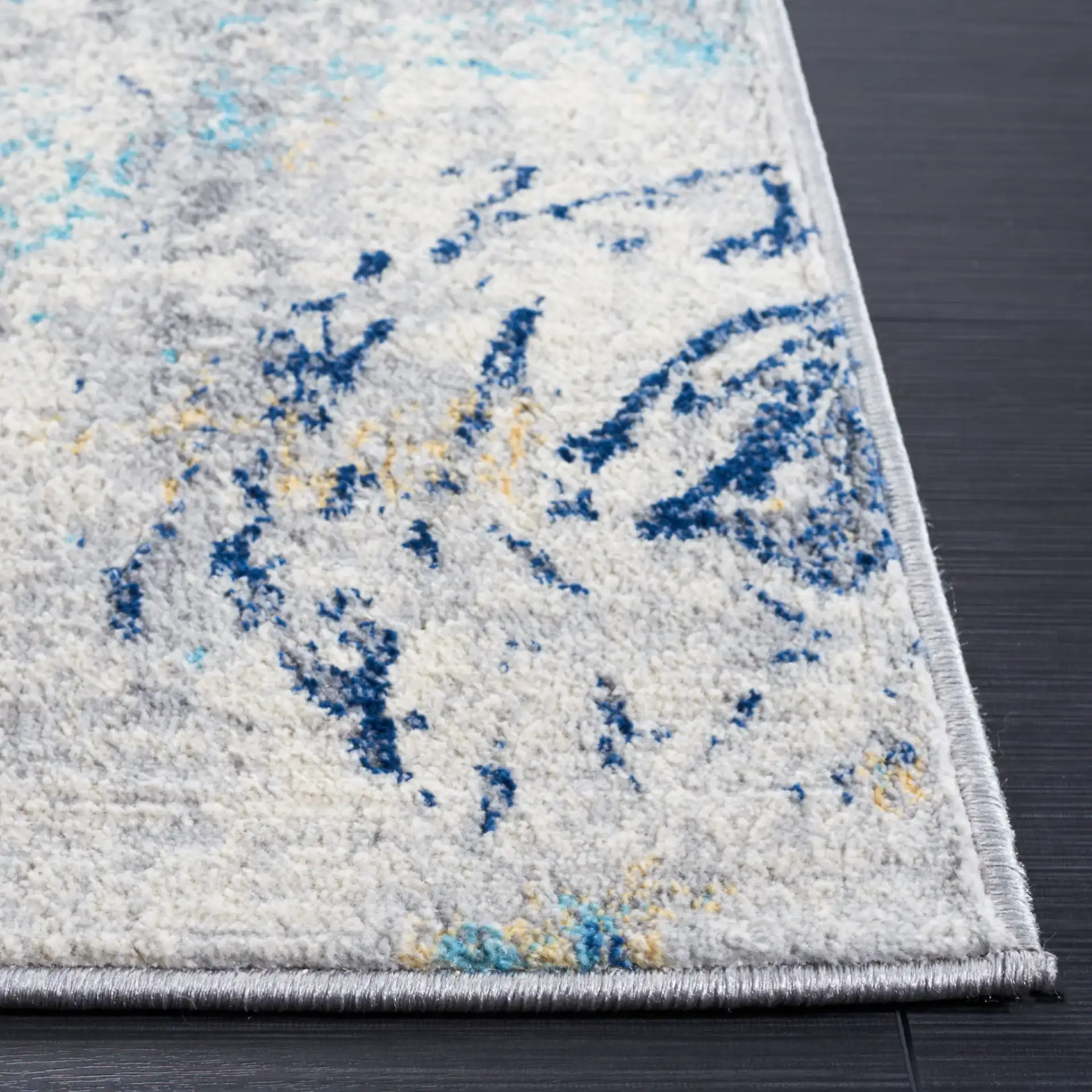 Jasper Marble Rug in Ivory / Blue in a styled room