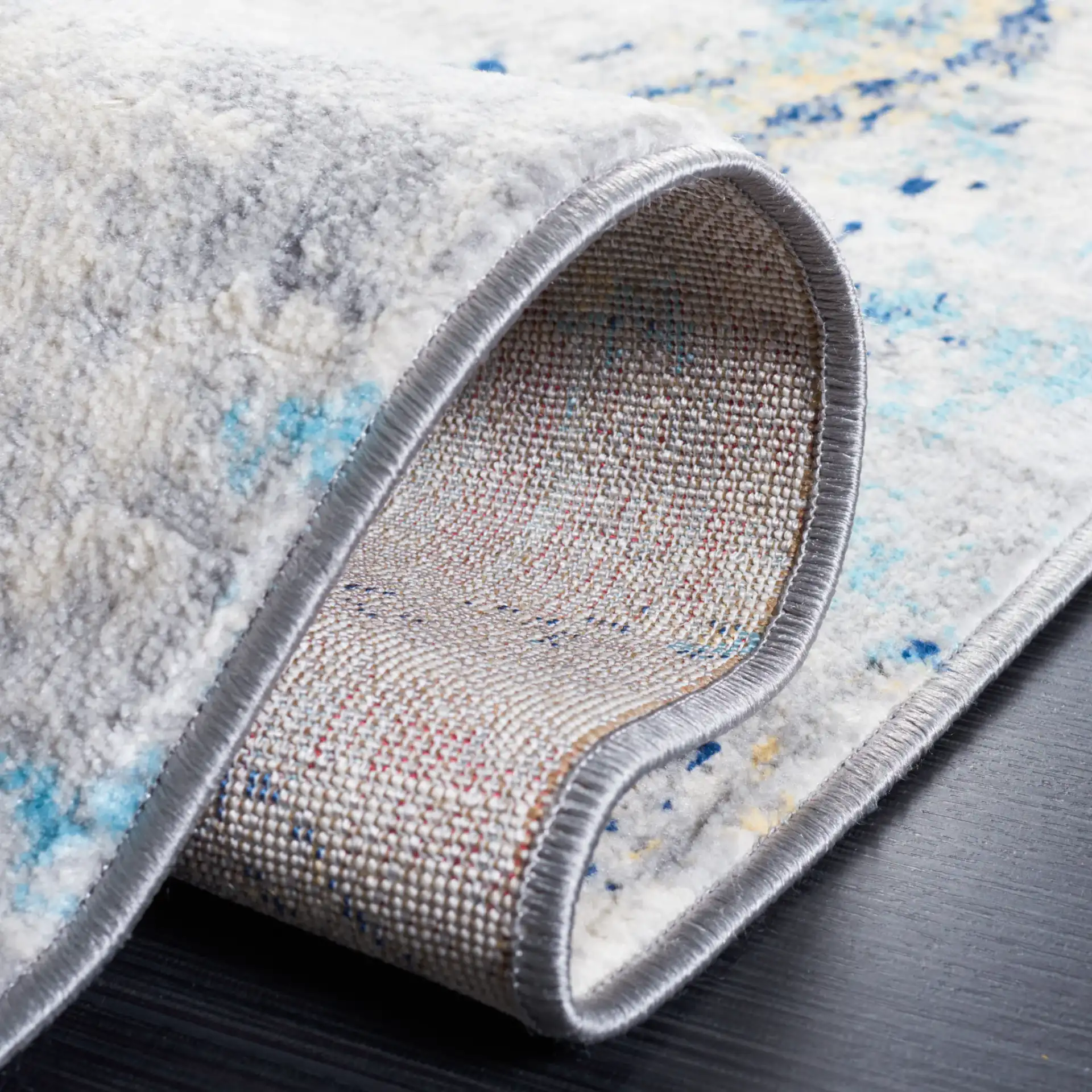 Jasper Marble Rug in Ivory / Blue in a styled room