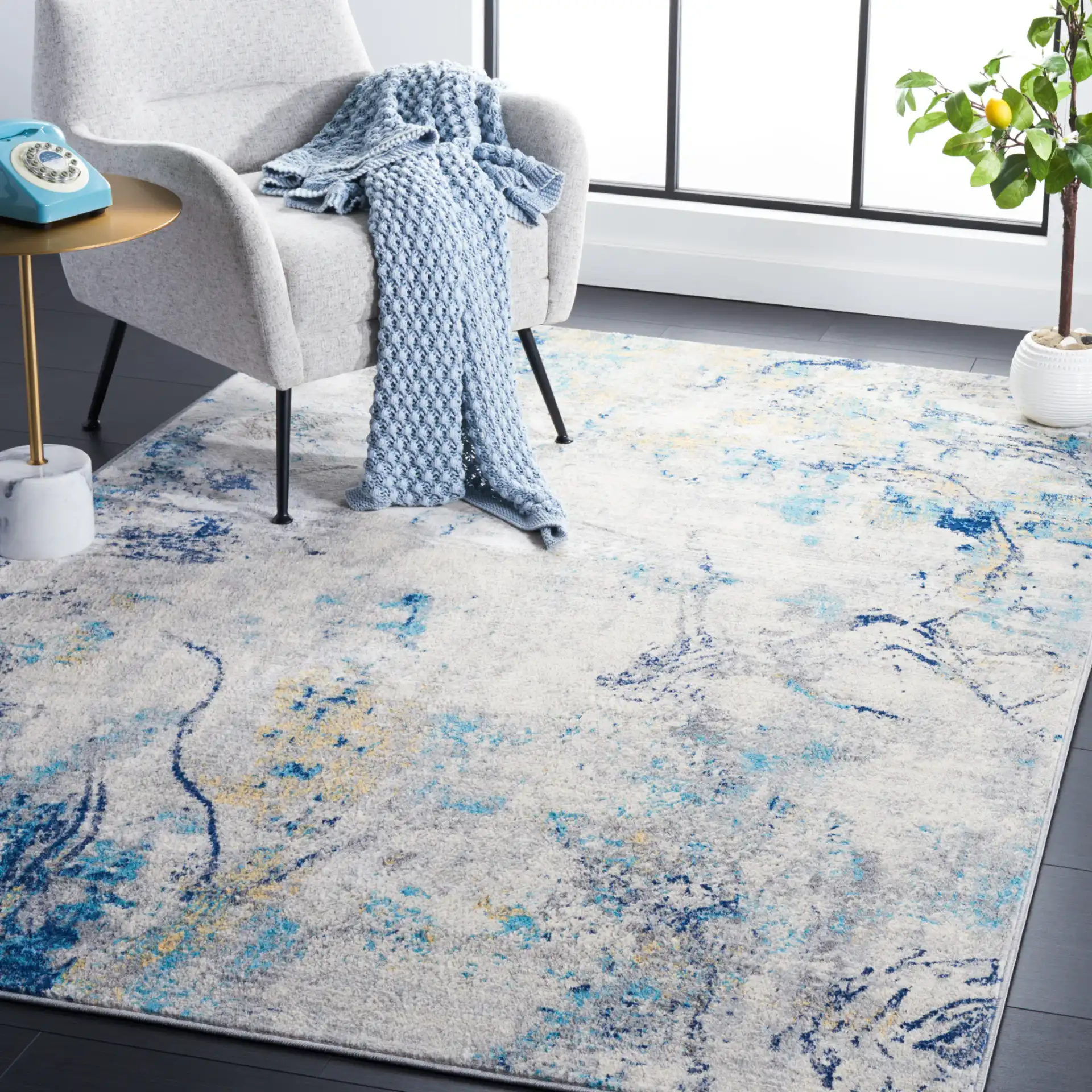 Jasper Marble Rug in Ivory / Blue in a styled room