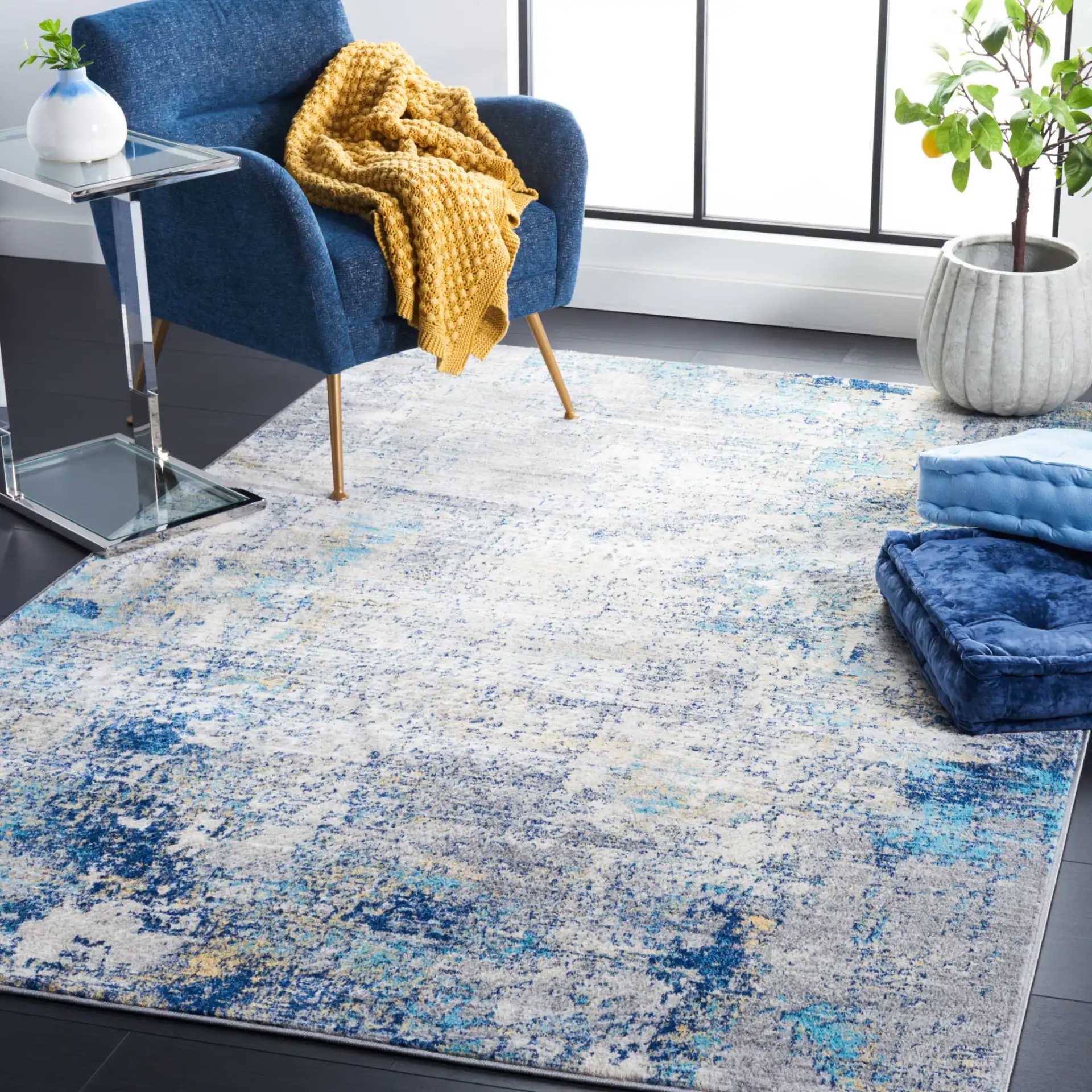 Jasper Abstract Rug in Gray / Blue in a styled room