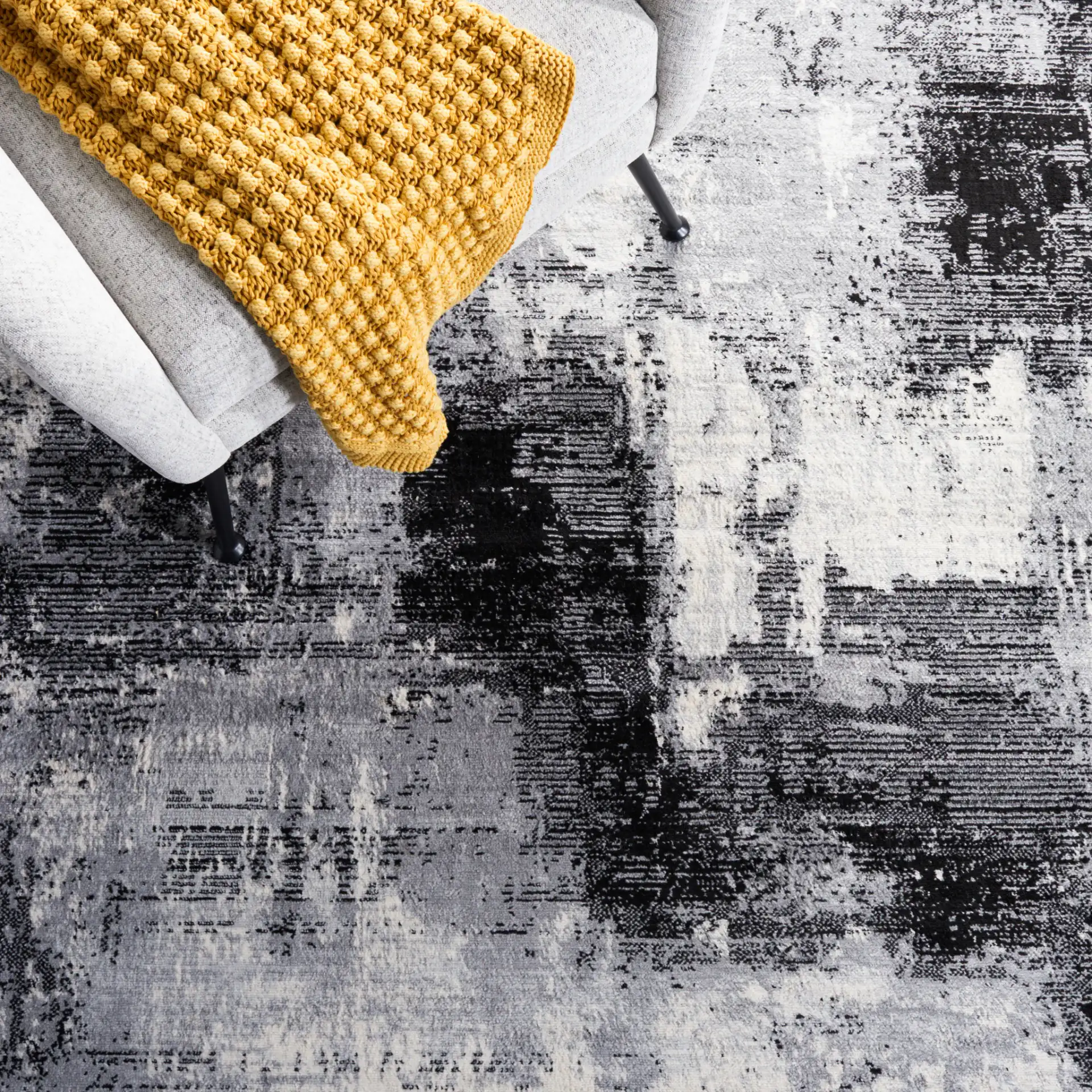 Jasper Abstract Block Rug in Black / Ivory in a styled room