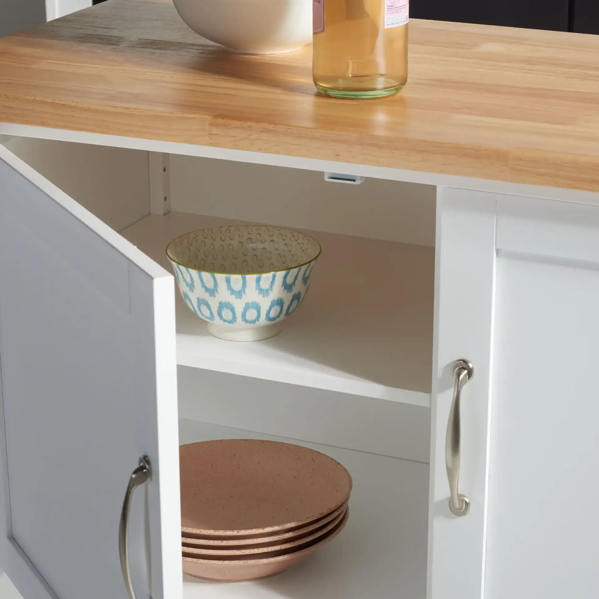 Kesler Two-Door One-Shelf Cart in White / Natural in a styled room