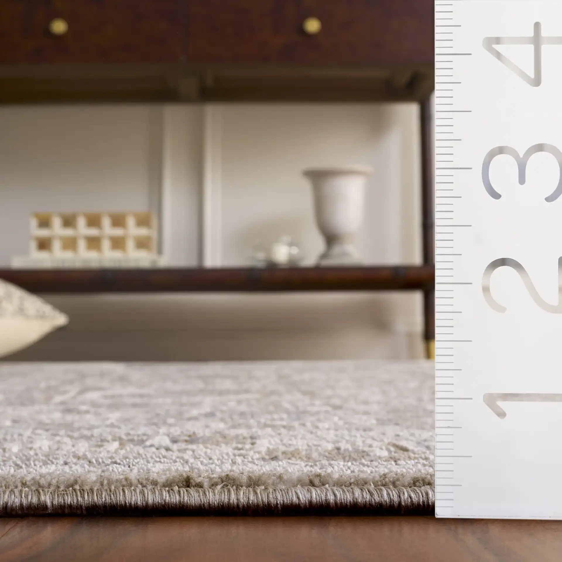 Kendal Distressed Medallion Bordered Rug in Gray / Ivory Beige in a styled room