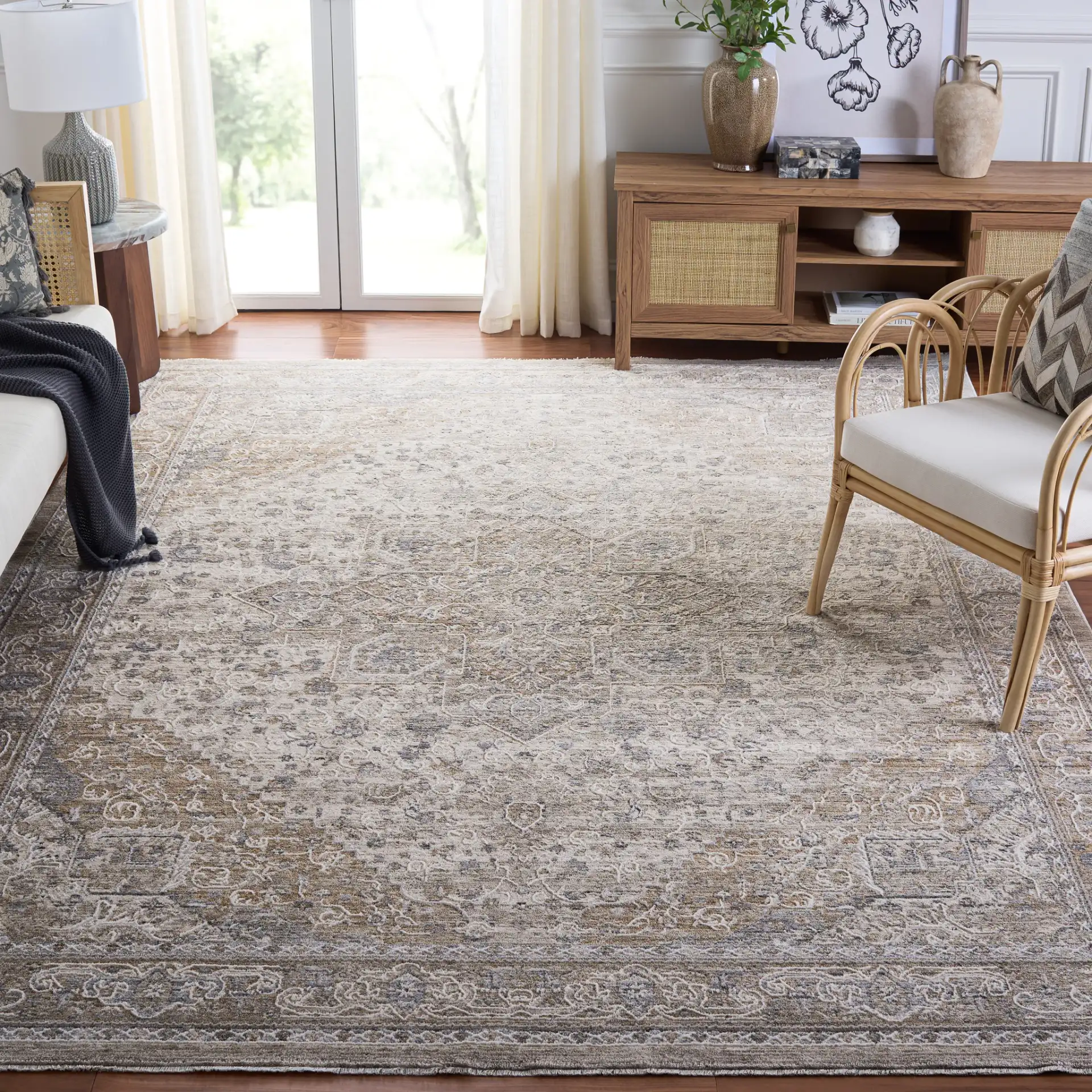 Kendal Distressed Medallion Bordered Rug in Gray / Ivory Beige in a styled room