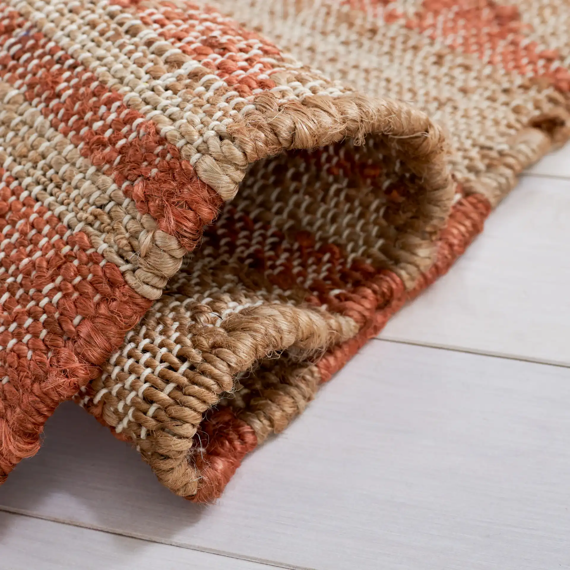 Kilim Striped Triangle Flatweave Jute Rug in Natural / Rust in a styled room