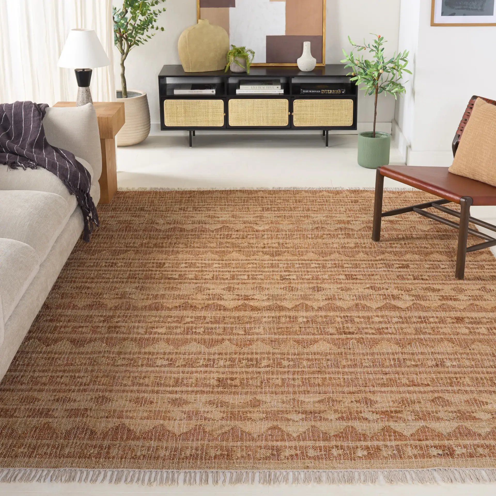 Kilim Striped Triangle Flatweave Jute Rug in Natural / Rust in a styled room