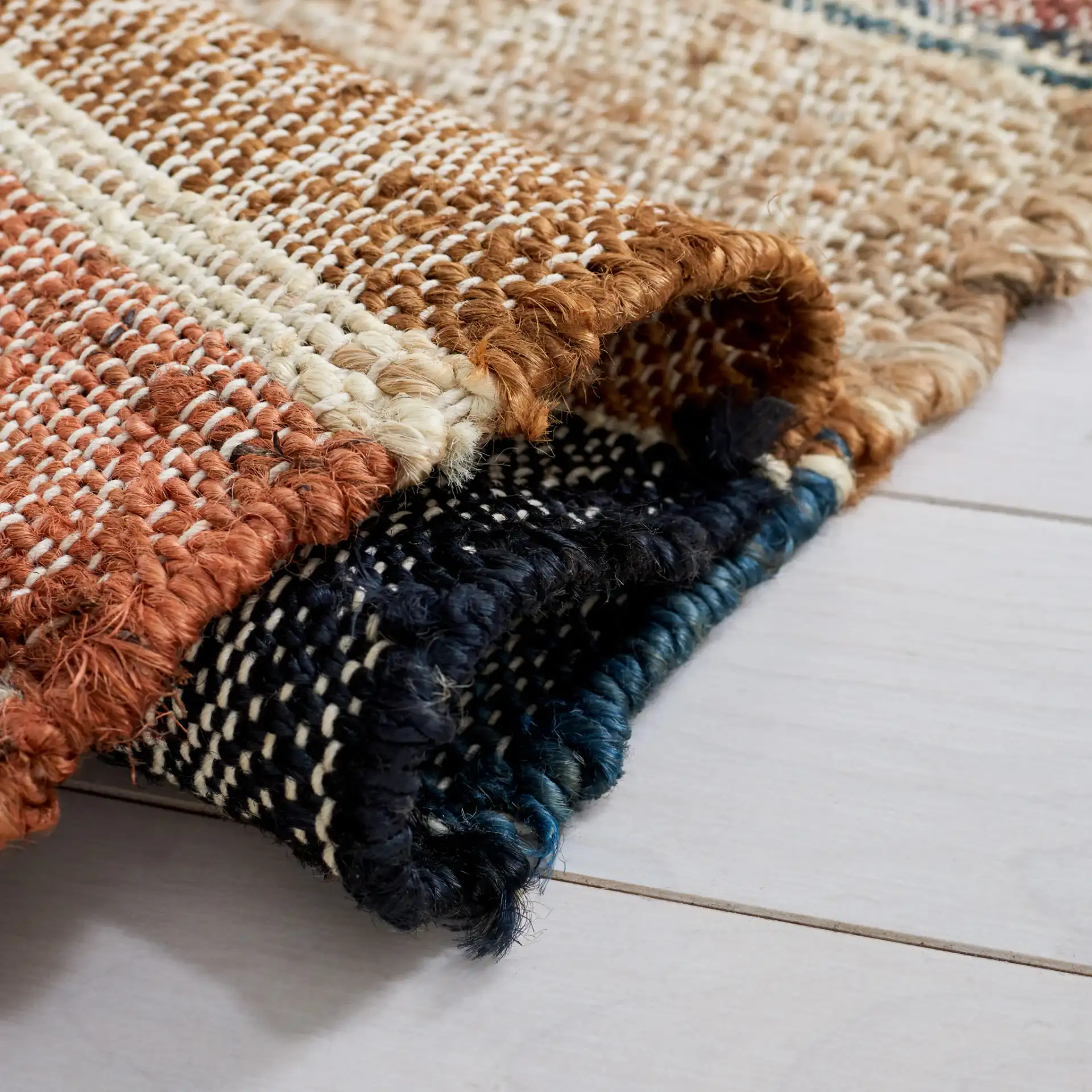 Kilim Banded Diamond Flatweave Jute Rug in Blue / Rust in a styled room