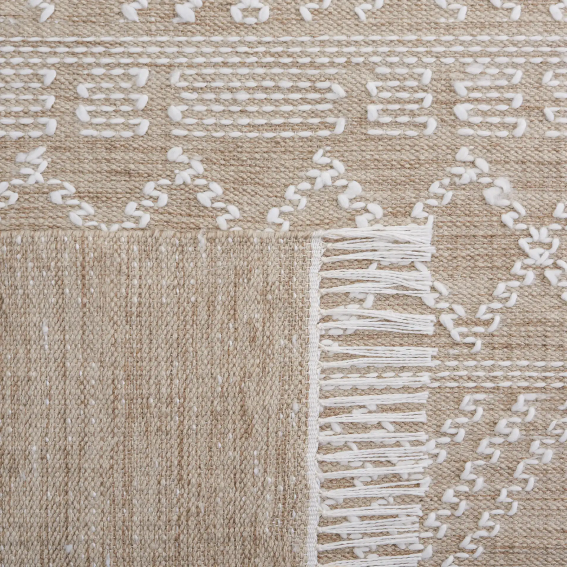 Kilim Chevron Diamond Flatweave Rug in Beige / Ivory in a styled room