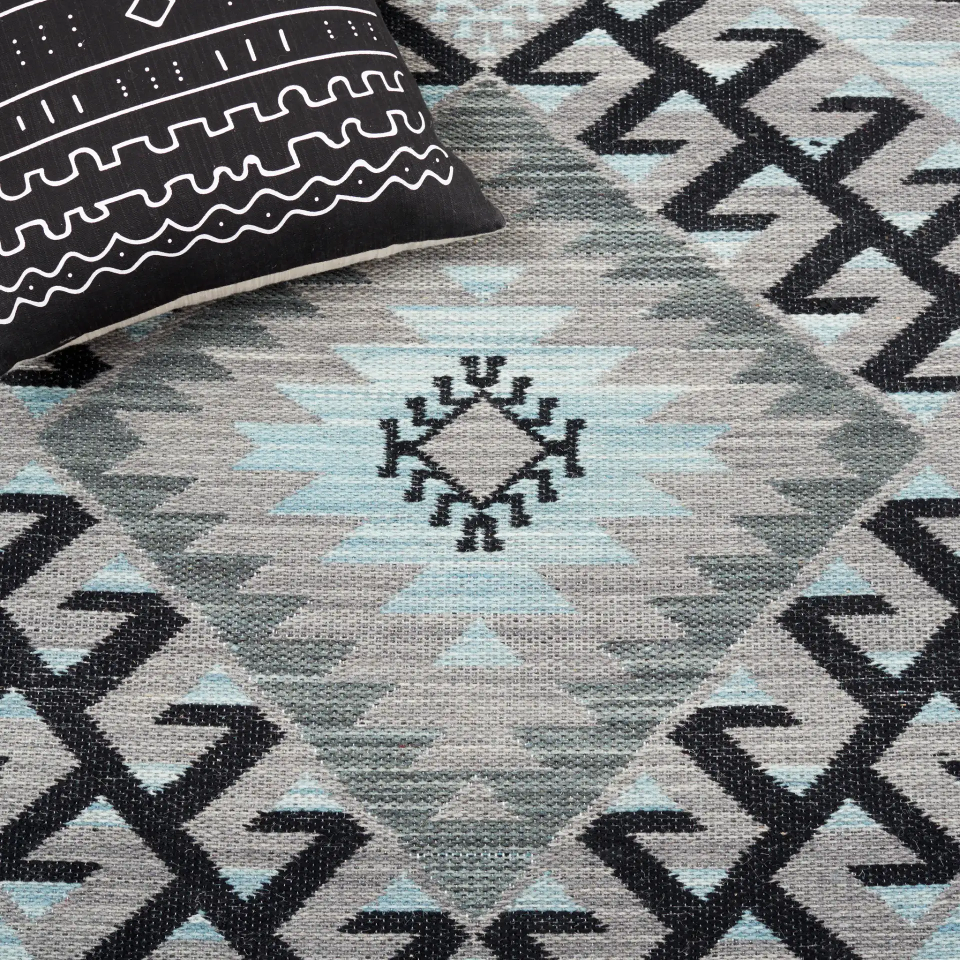 Kilim Tribal Diamond Medallion Hand-Woven Rug in Gray / Black in a styled room