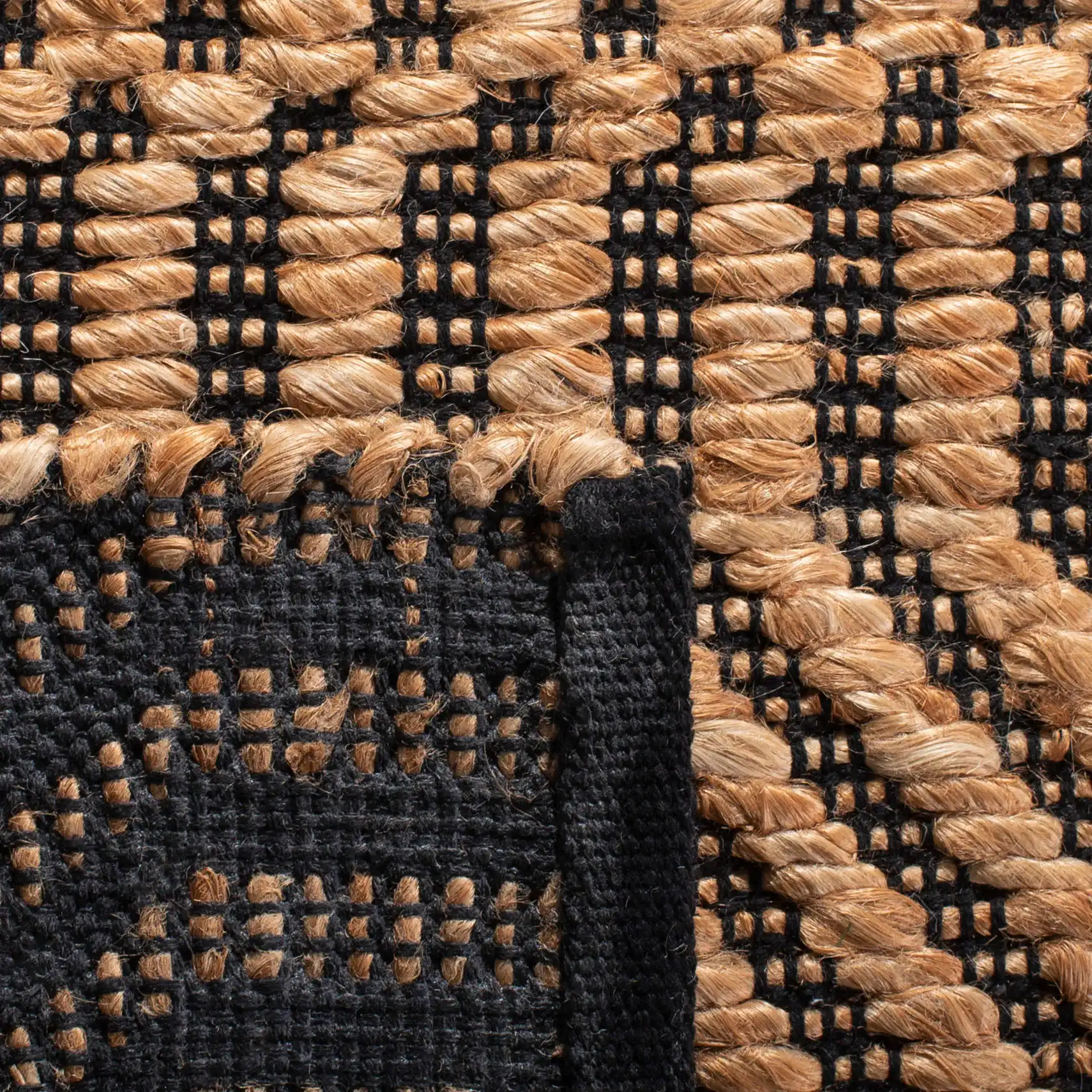 Kilim Coastal Diamond Chevron Hand-Woven Jute Rug in Natural / Black in a styled room