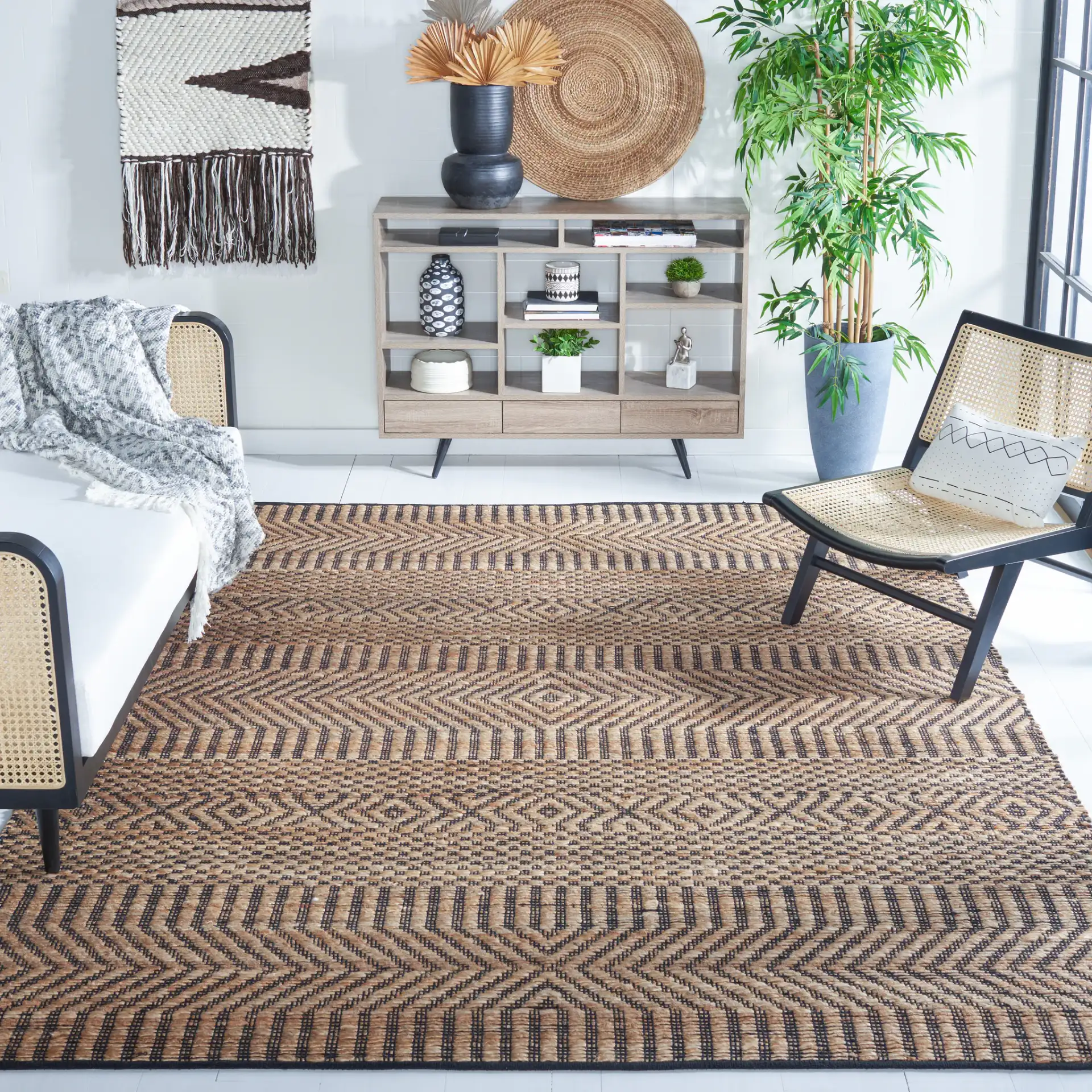 Kilim Coastal Diamond Chevron Hand-Woven Jute Rug in Natural / Black in a styled room