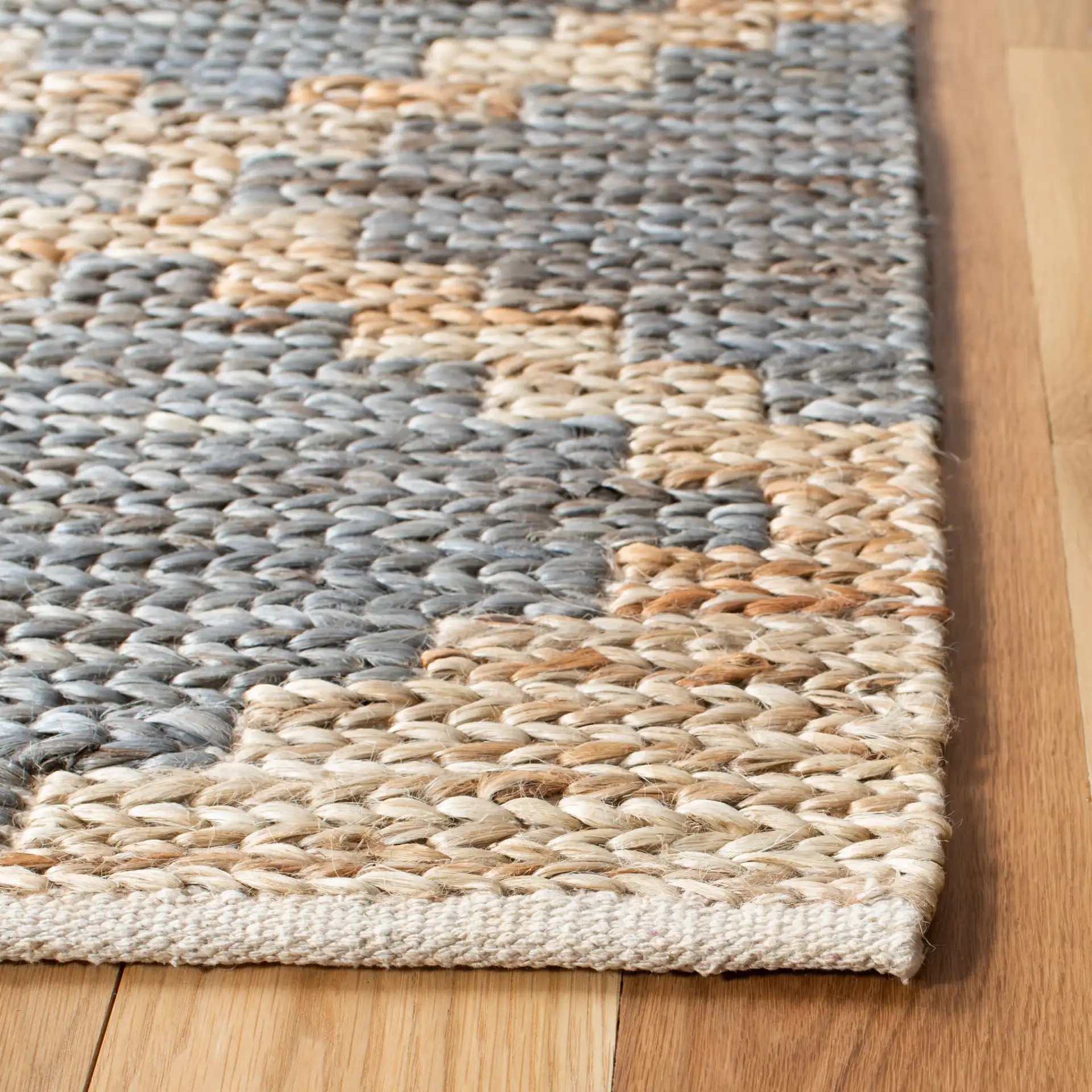 Kilim Tribal Diamond Jute Hand-Woven Rug in Natural / Gray in a styled room