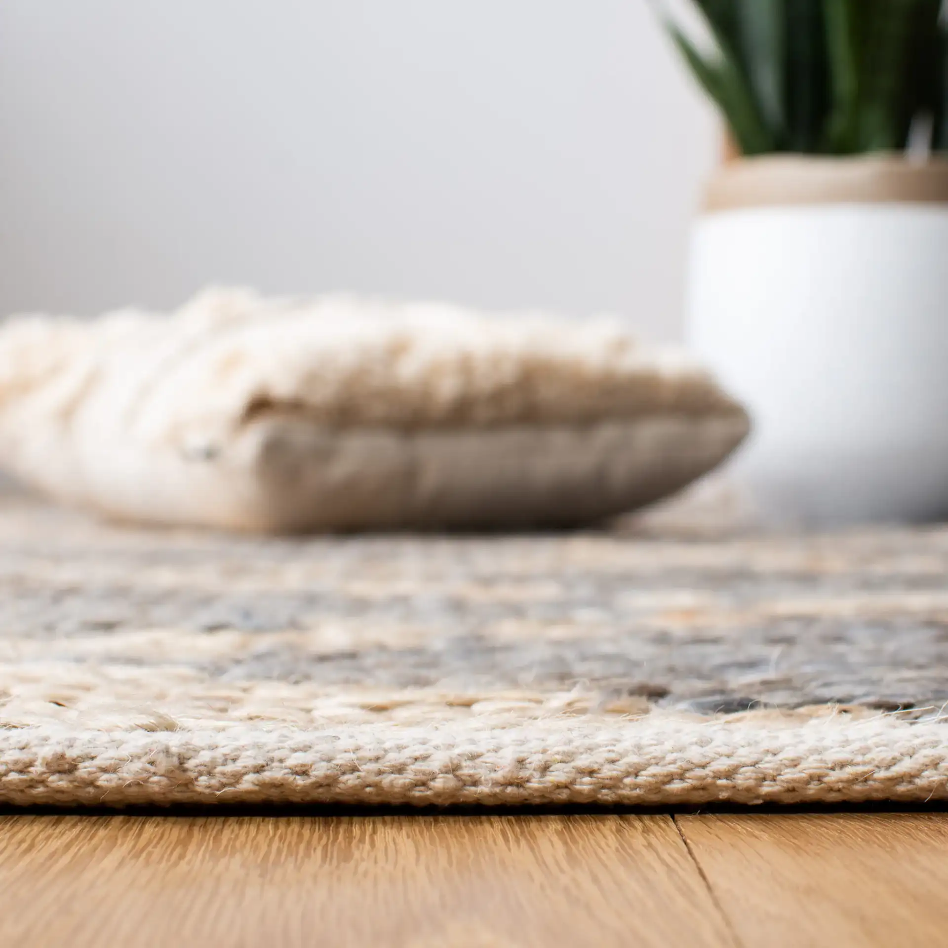 Kilim Tribal Diamond Jute Hand-Woven Rug in Natural / Gray in a styled room