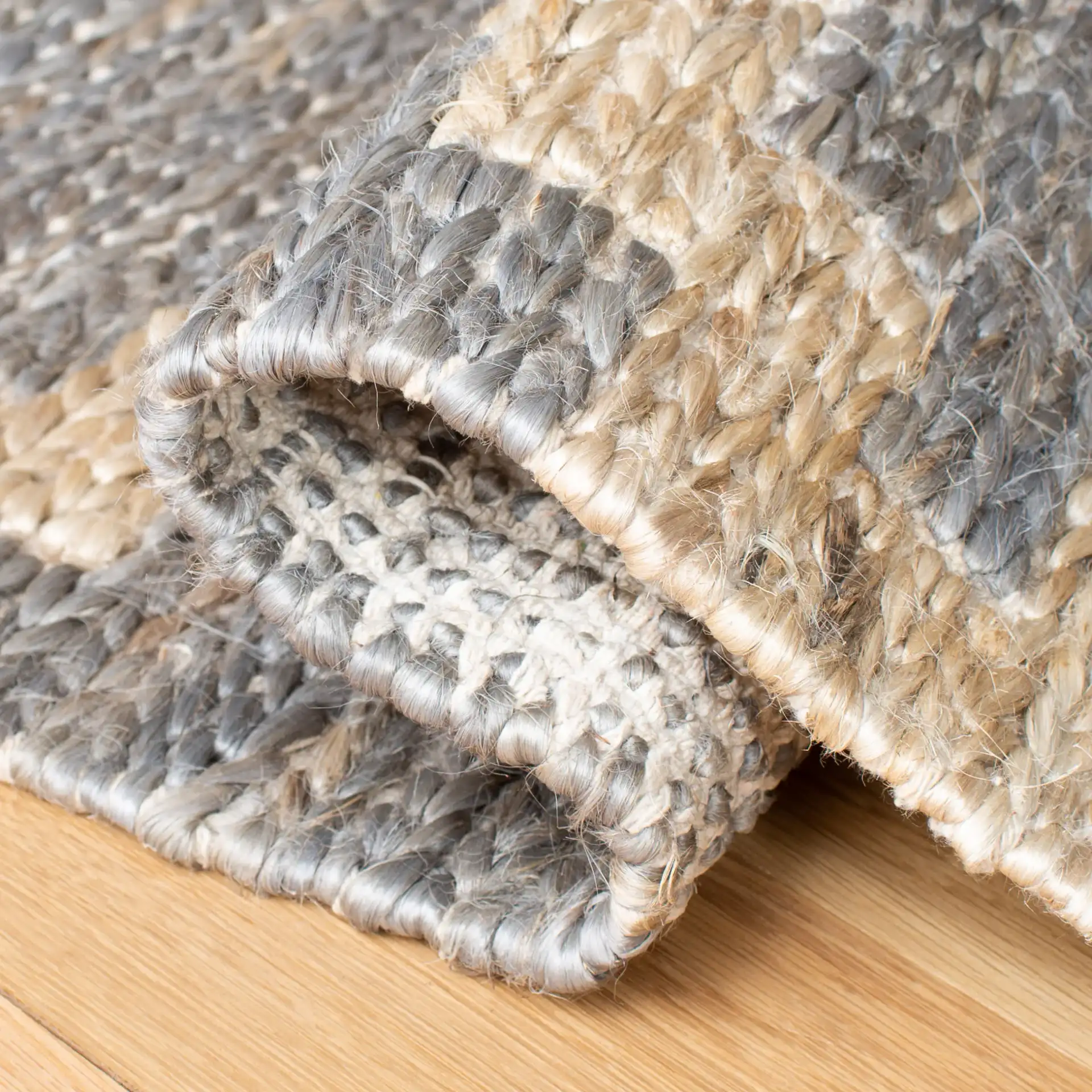 Kilim Tribal Diamond Jute Hand-Woven Rug in Natural / Gray in a styled room