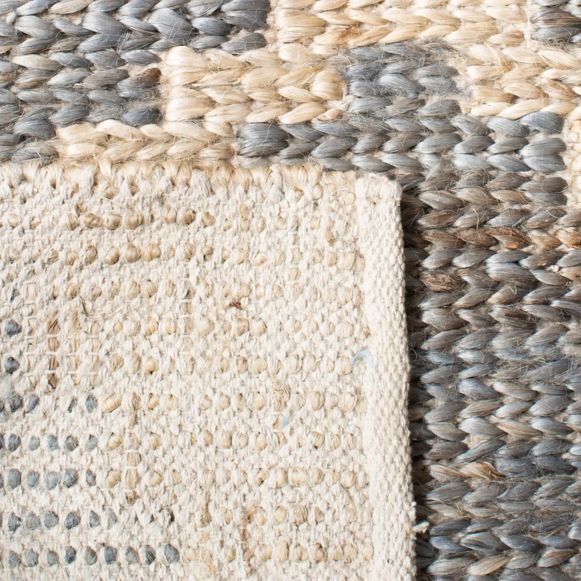Kilim Tribal Diamond Jute Hand-Woven Rug in Natural / Gray in a styled room