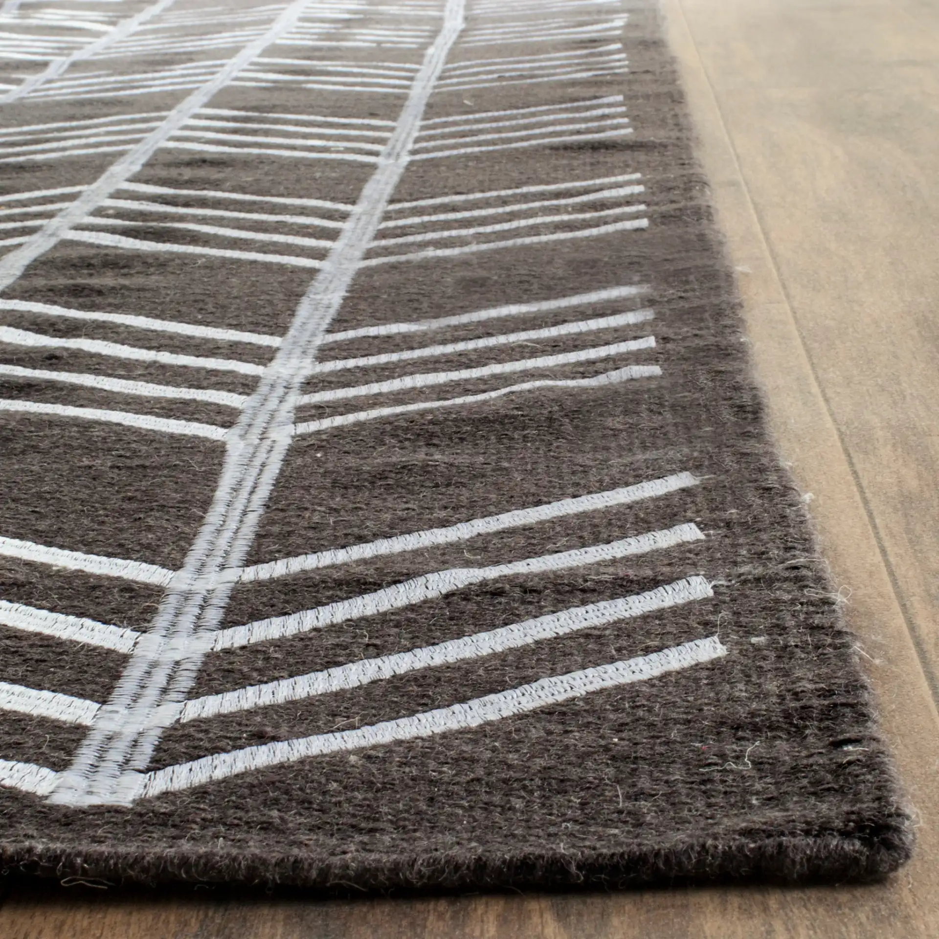 Kilim Herringbone Stripe Hand-Woven Wool Rug in Charcoal in a styled room