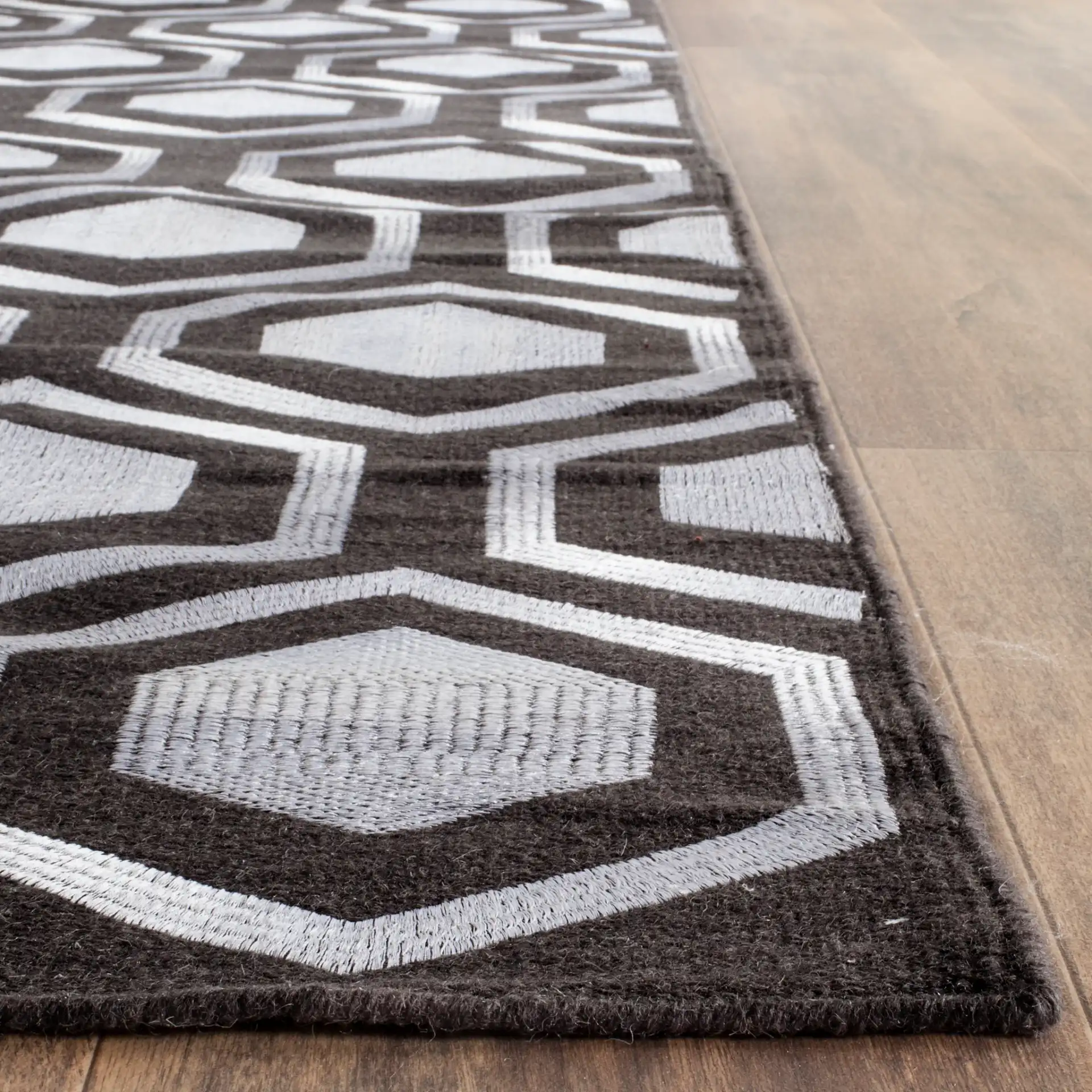 Kilim Hexagon Hand-Woven Wool Rug in Charcoal in a styled room