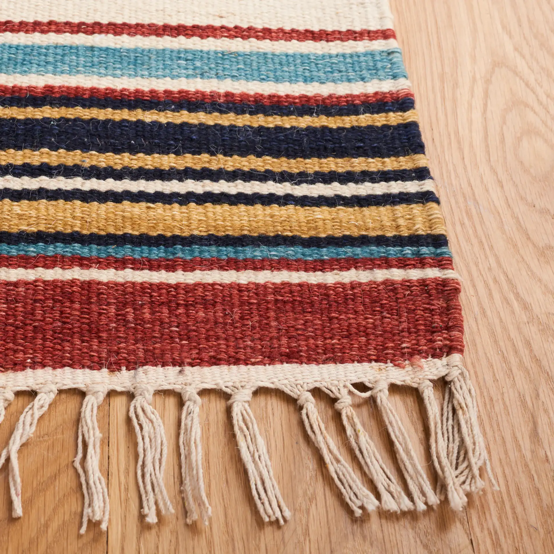 Kilim Banded Diamond Flatweave Wool Rug in Ivory / Rust in a styled room