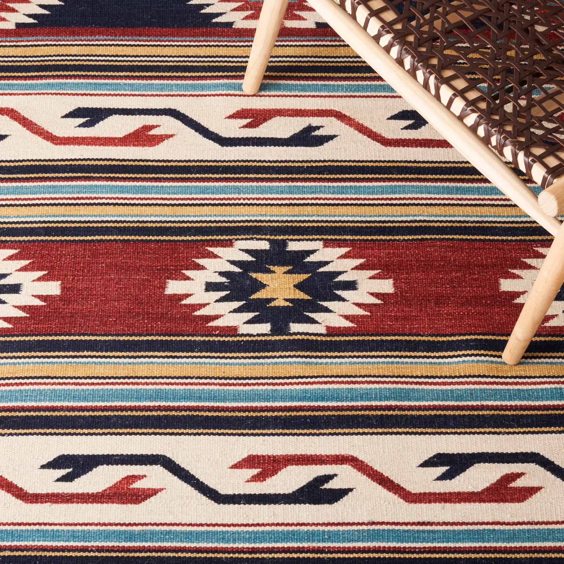 Kilim Banded Diamond Flatweave Wool Rug in Ivory / Rust in a styled room