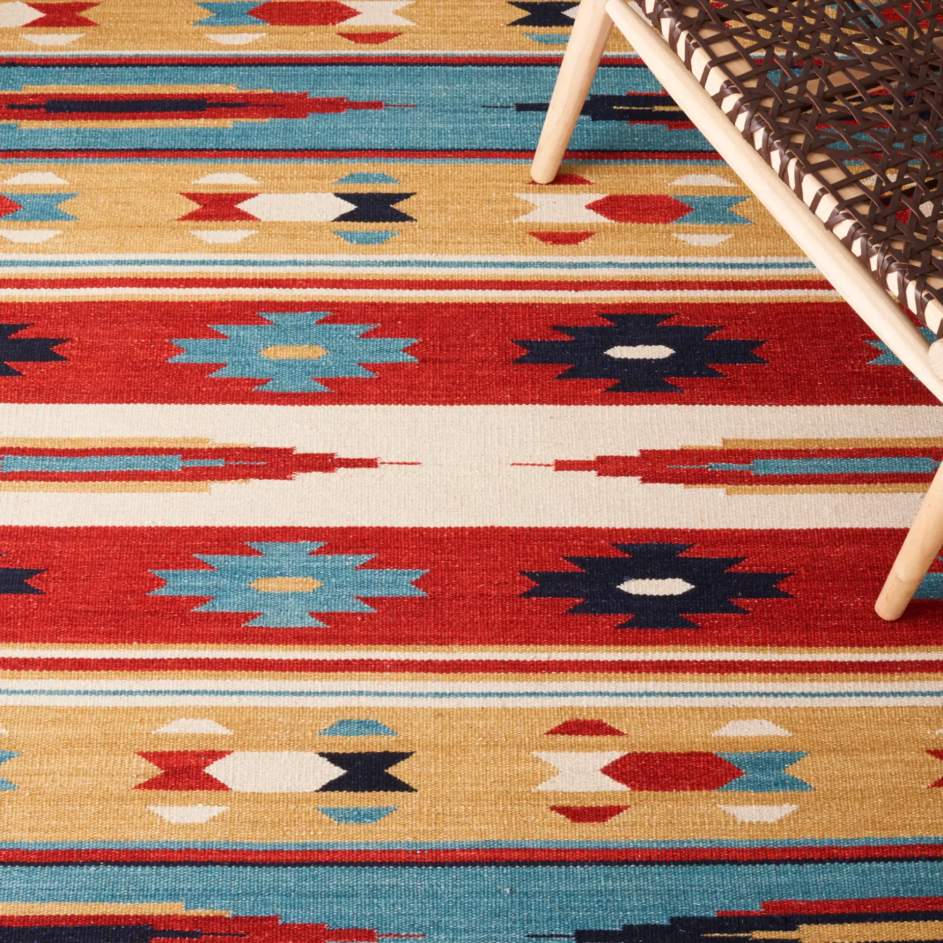 Kilim Tribal Stripe Flatweave Wool Rug in Beige / Red in a styled room
