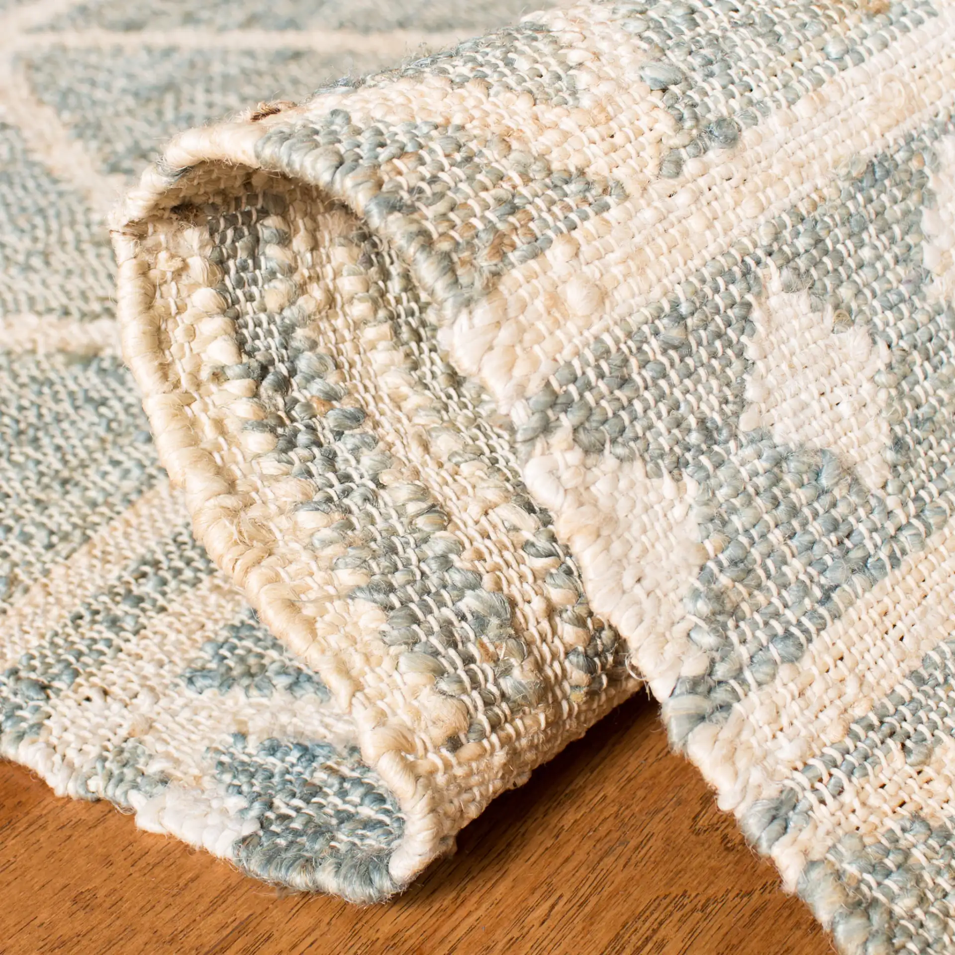 Kilim Chevron Stripe Hand-Loomed Jute Rug in Blue / Beige in a styled room